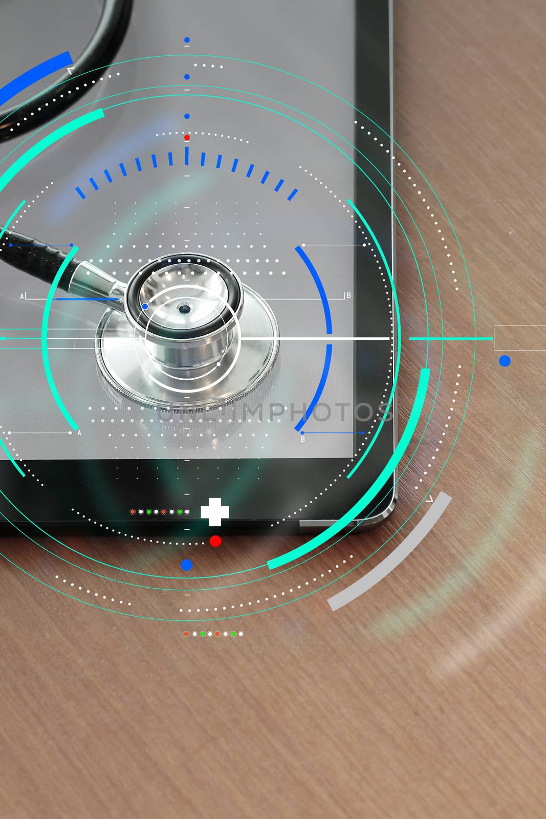 Stethoscope with digital tablet computer on wooden table and  ba by everythingpossible
