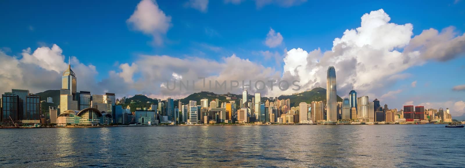Panoramic view of Victoria Harbor and Hong Kong skyline  by f11photo