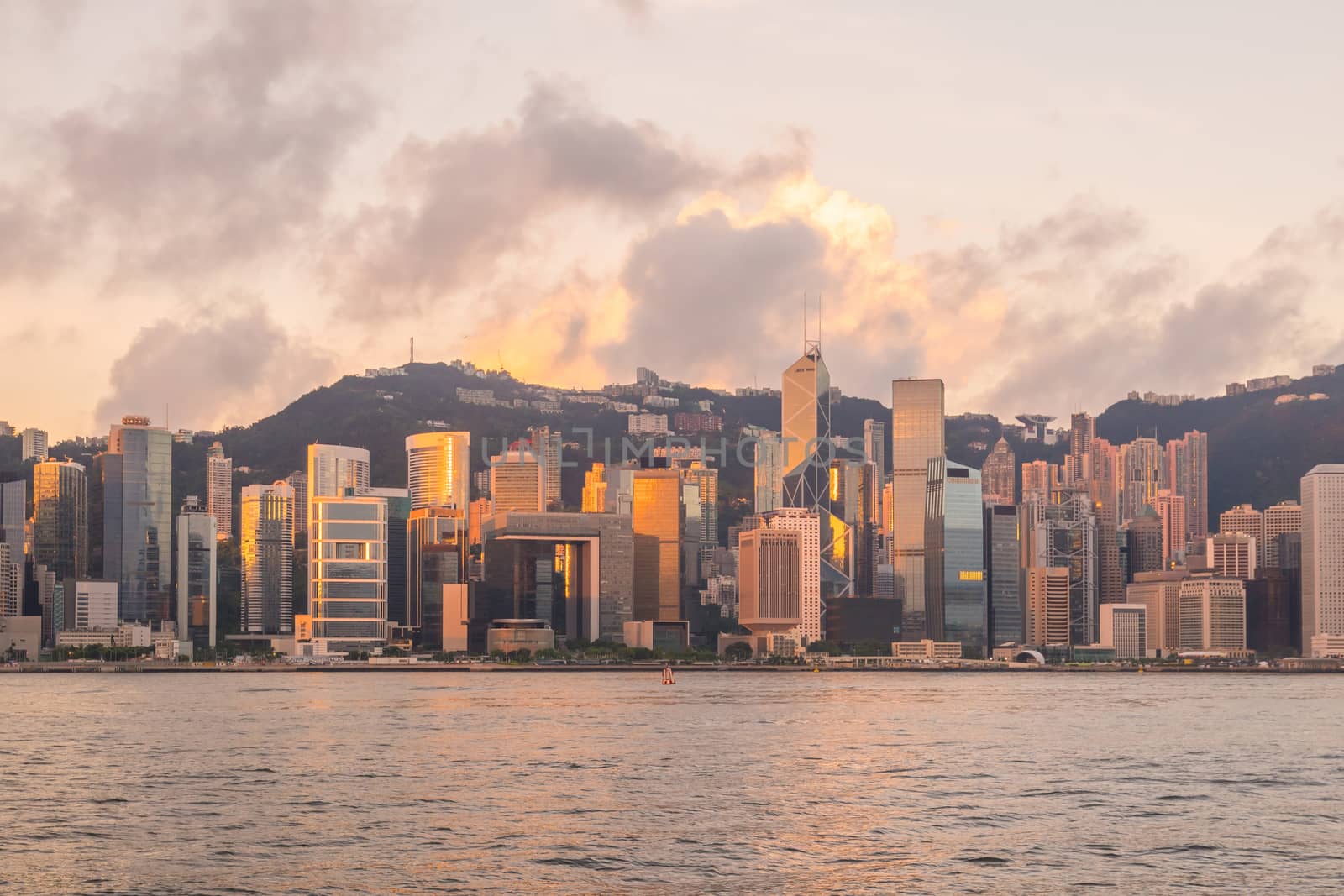 Panoramic view of Victoria Harbor and Hong Kong skyline  by f11photo