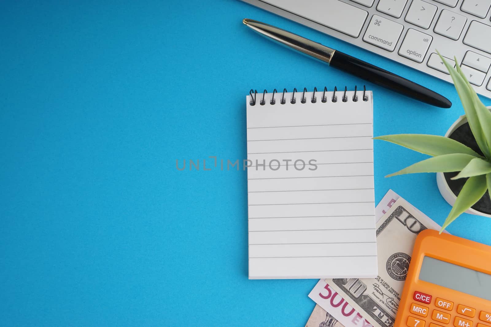 Flat lay of business with office stationary concept on blue background by silverwings