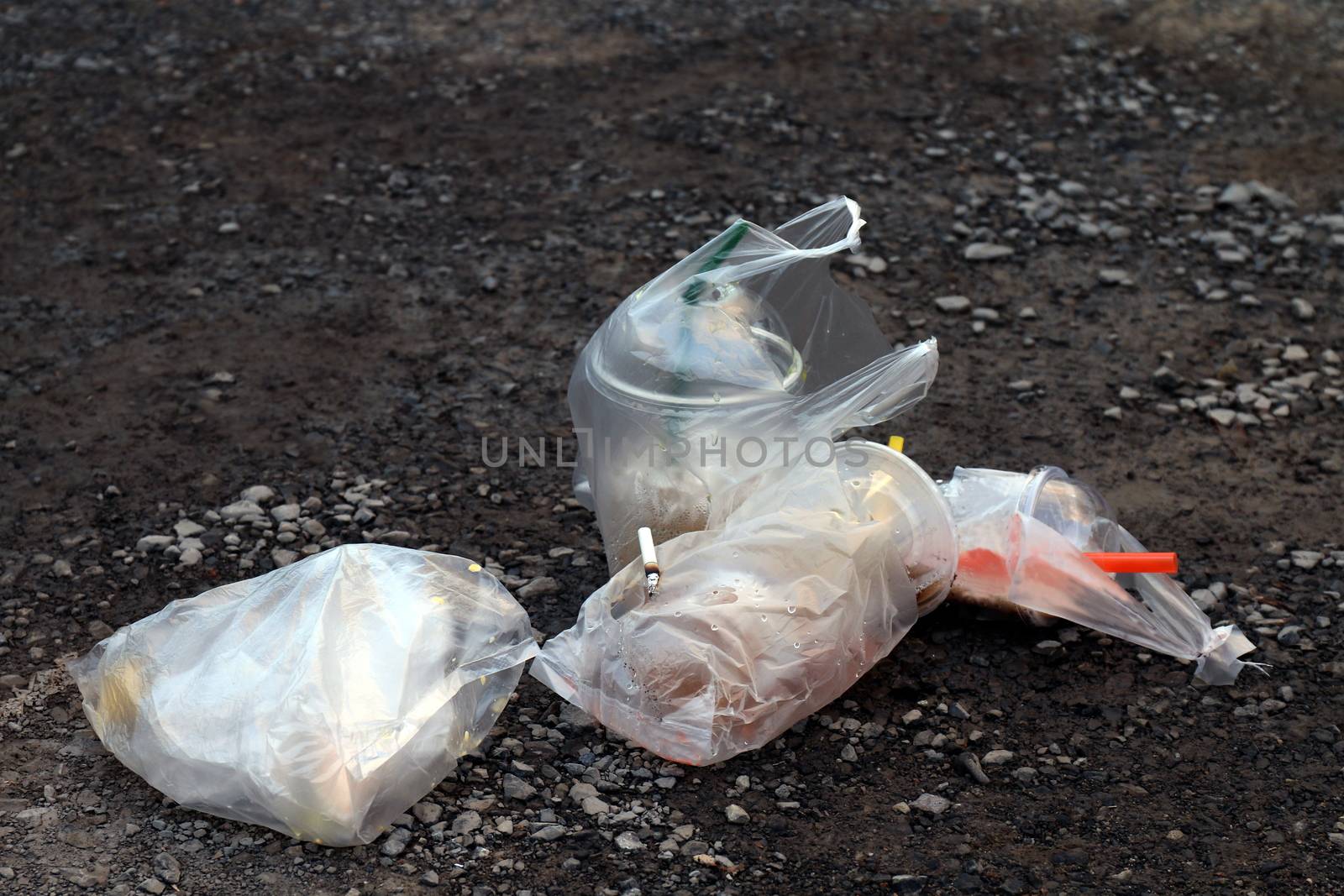 pile garbage trash drink glass and plastic bag, water cup Juice dirty on floor, plastic waste