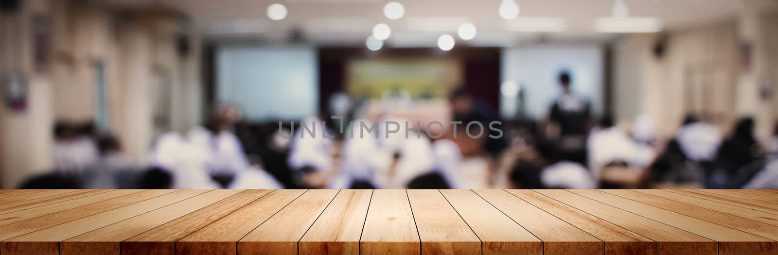 Panoramic empty clean wood counter table top on blur student stu by golfmhee