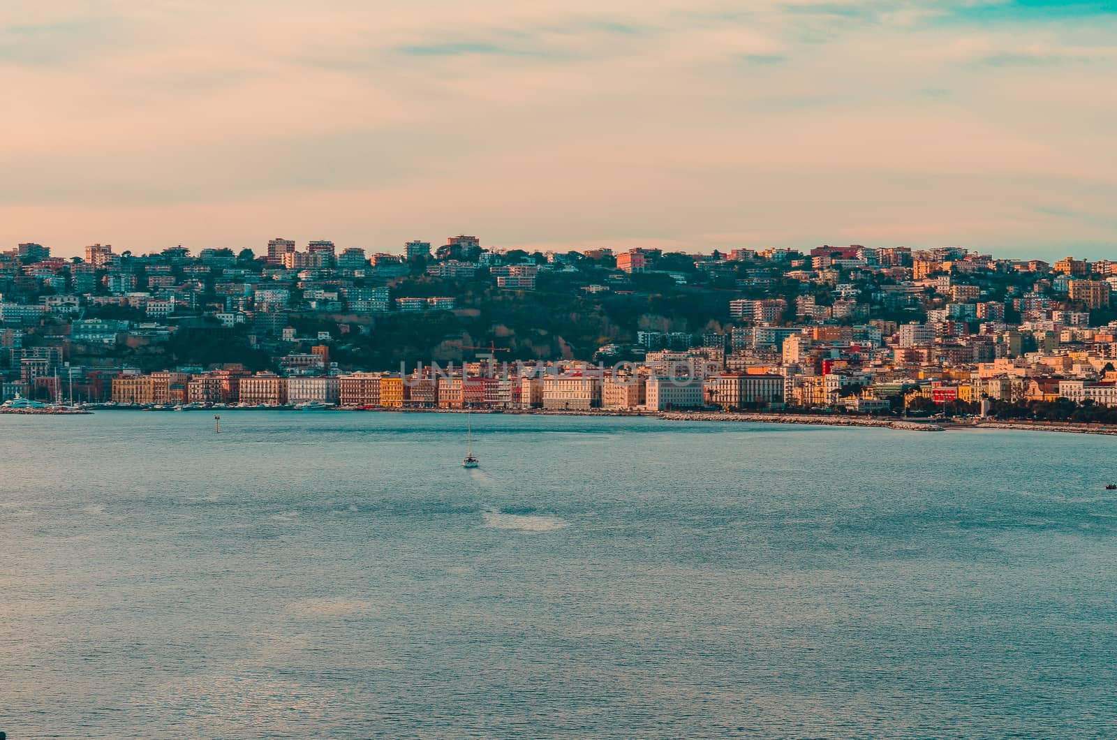 Neapolitan Bay in the rays of the setting sun. Naples, Italy