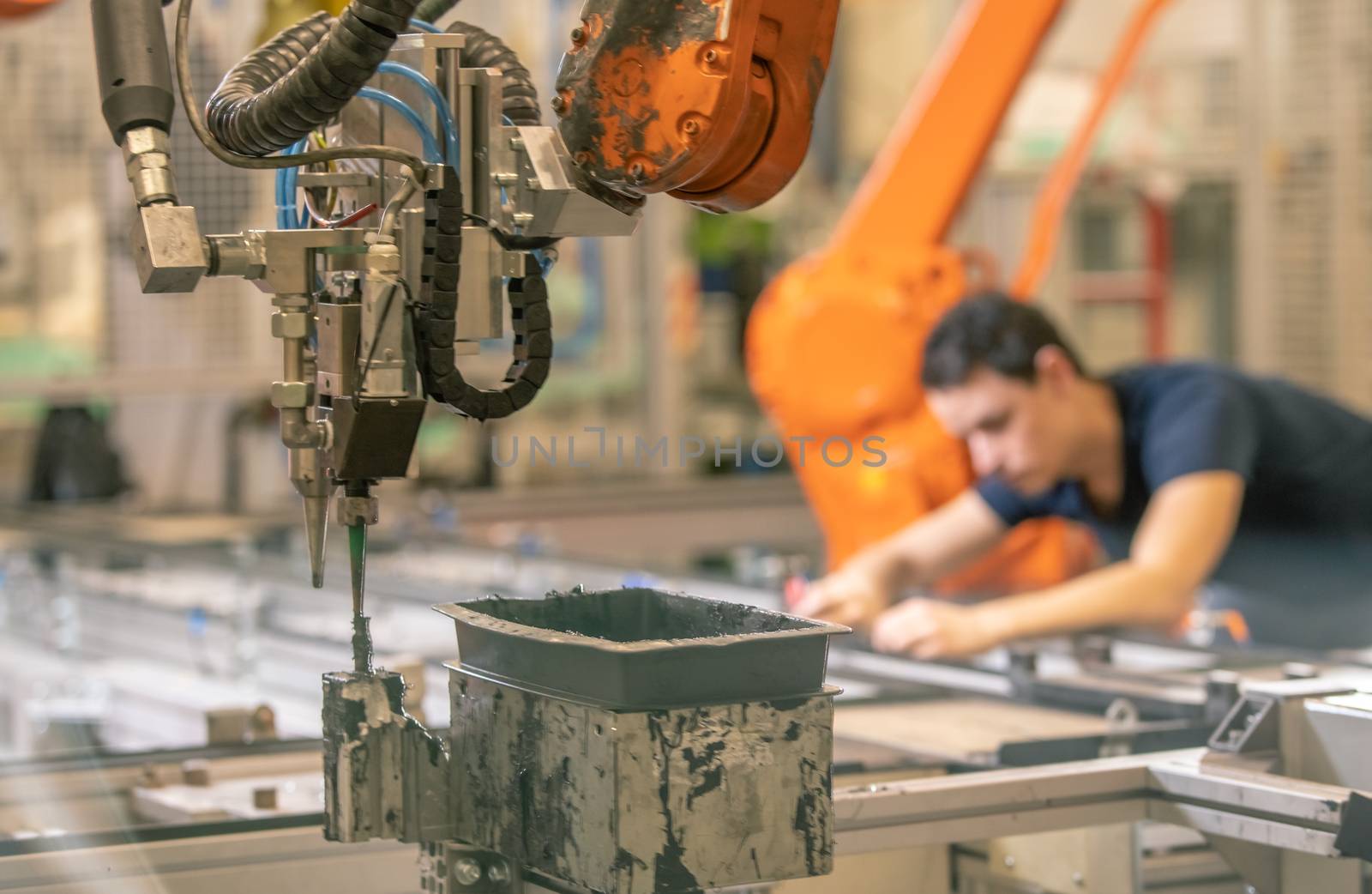 installation of new robot arms in the factory for modernization of production. Blurred by Edophoto