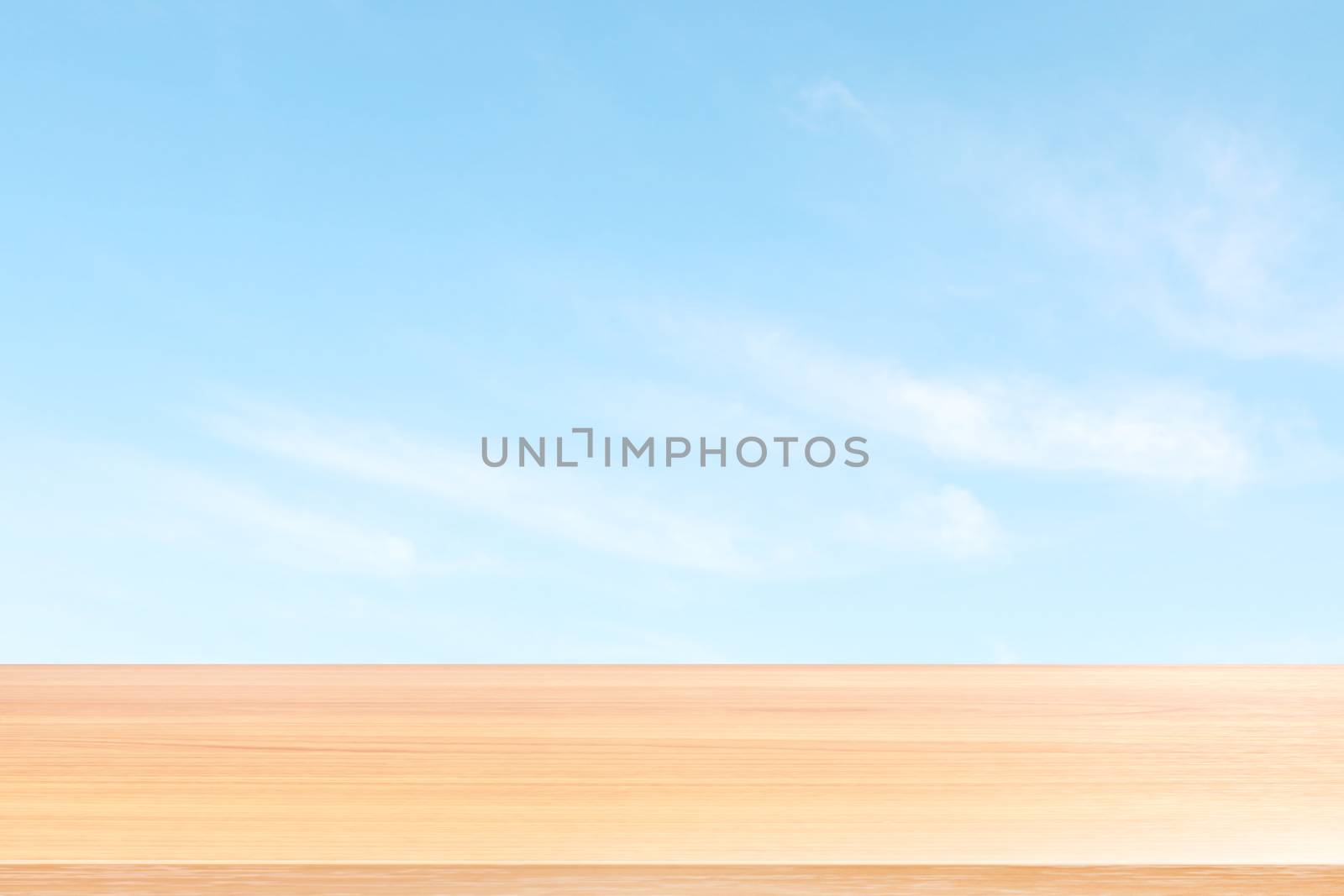 empty wood table floors on blurred blue sky and cloud background, wood table board empty front blur sky blue, wooden plank blank on sky with perspective brown wood table for mock up display products