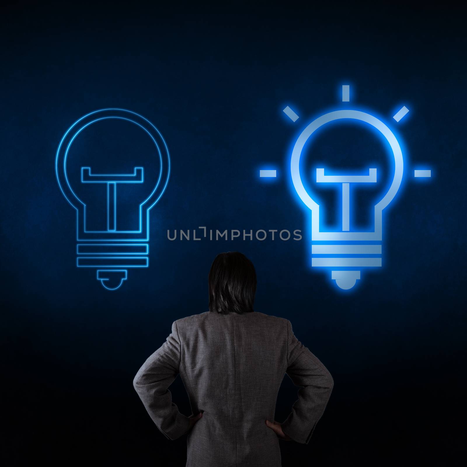 Light bulb and a business person as symbols of creativity  by everythingpossible