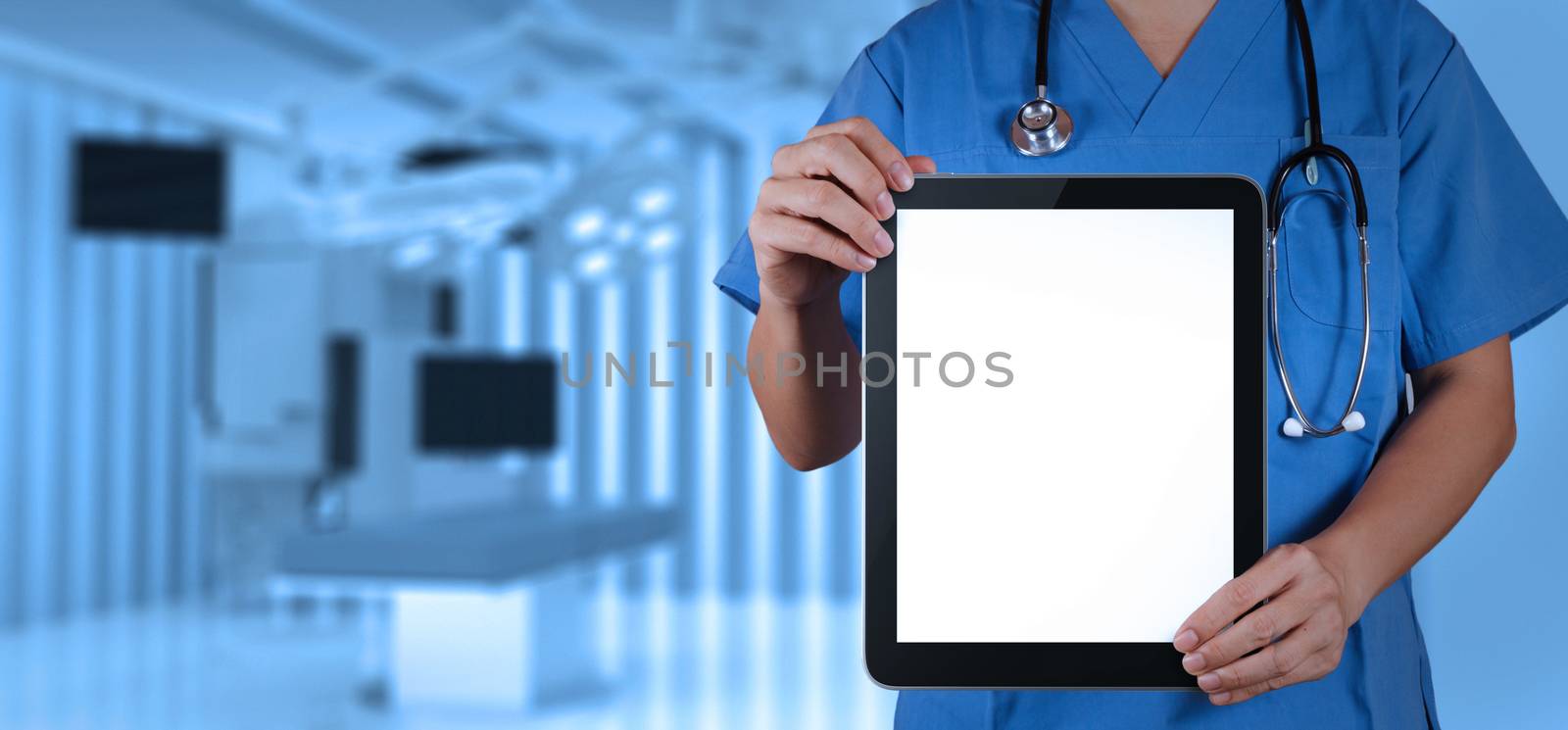 Doctor working with tablet computer with operating room