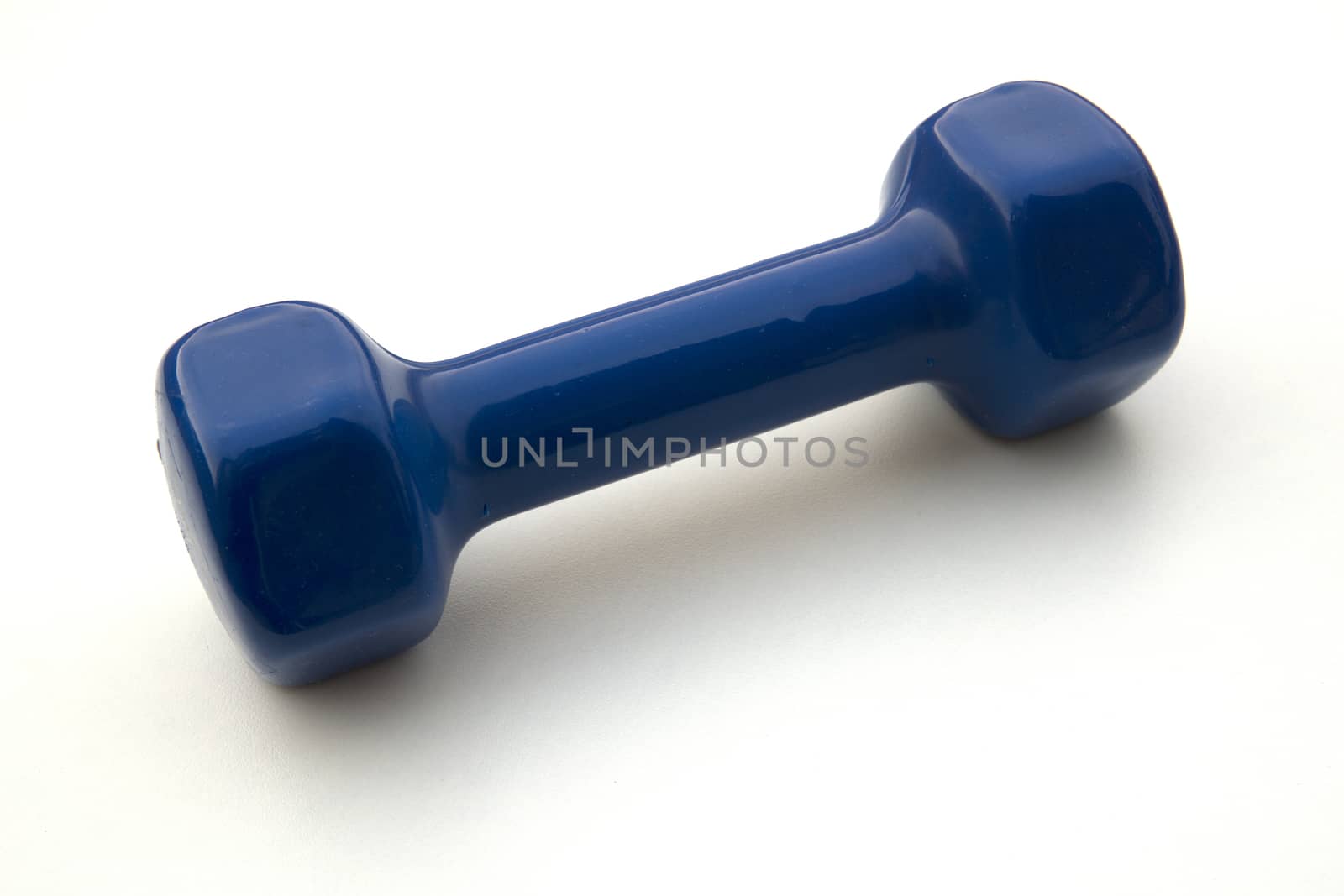 Blue Dumbell on white background. Exercising Equipment during lockdown and quarantine.