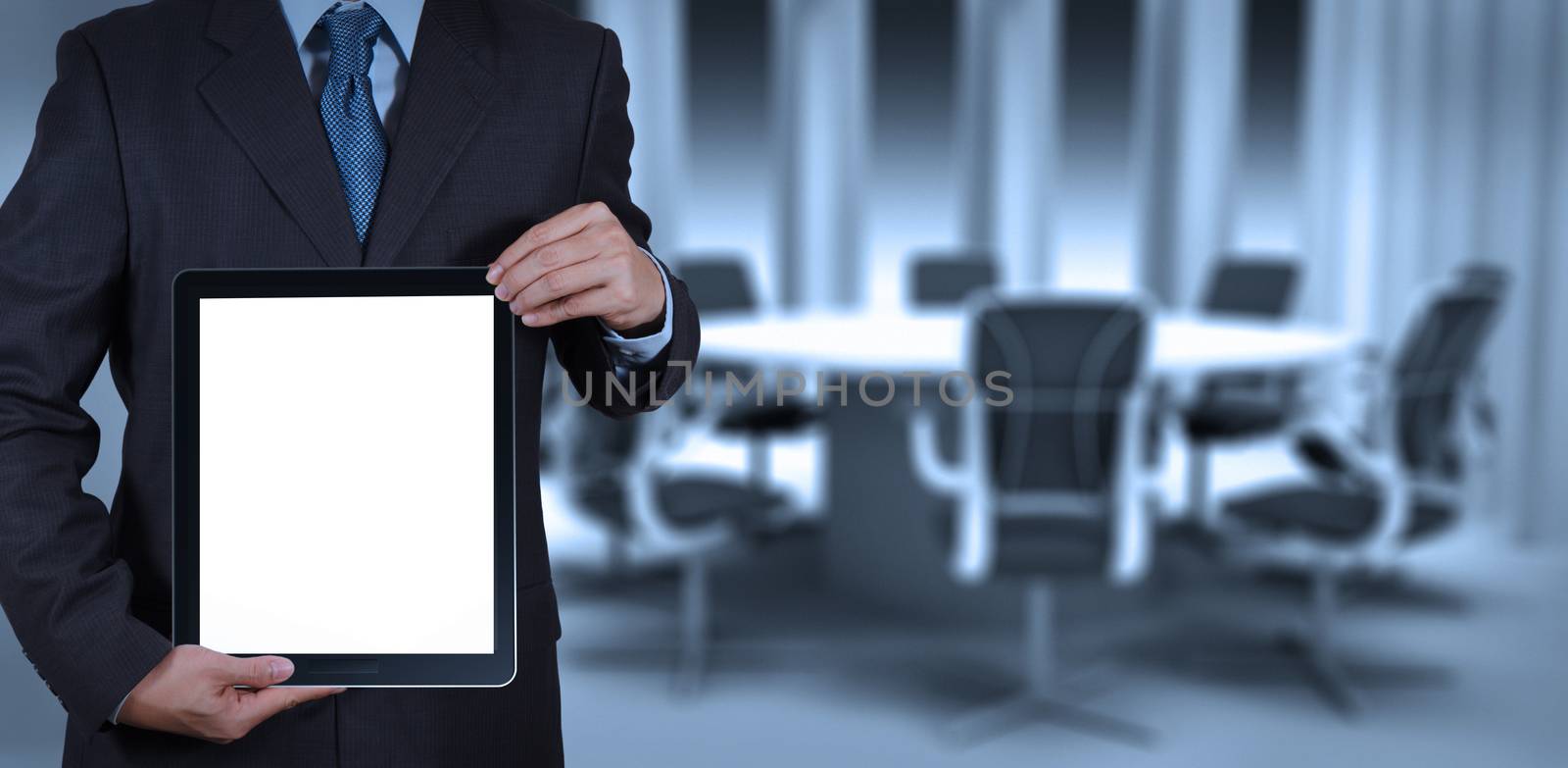 businessman success working with blank tablet computer his board by everythingpossible