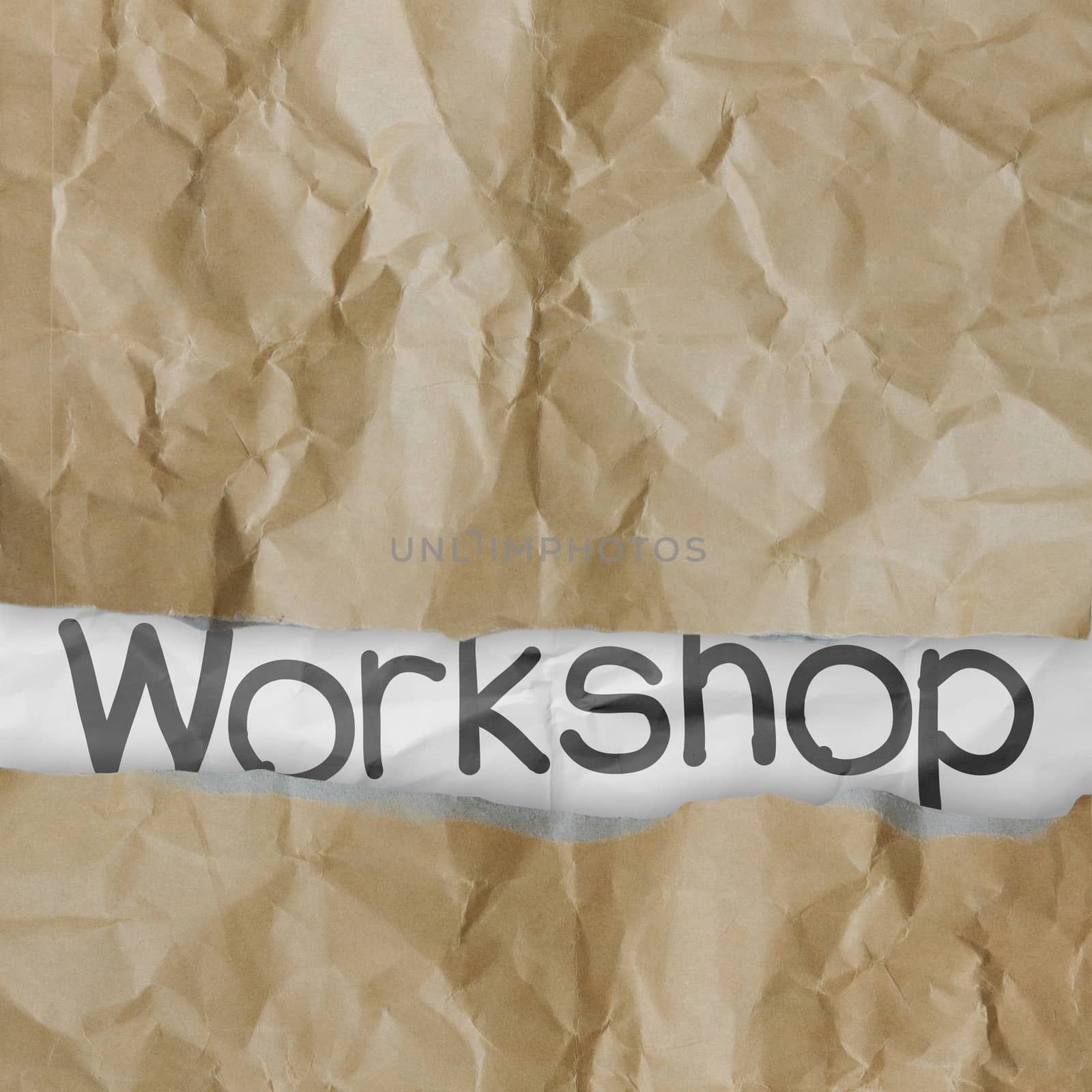 hand drawn workshop words on crumpled paper with tear envelope as concept