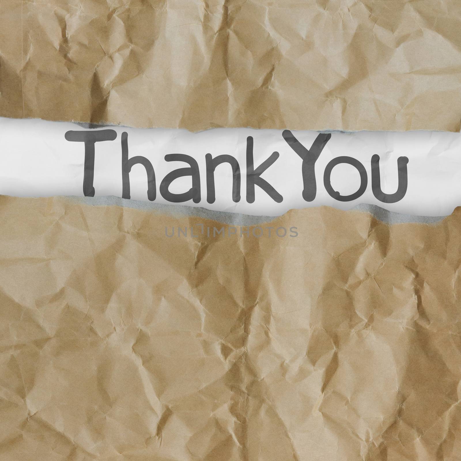 hand drawn thank you words on crumpled paper with tear envelope as concept