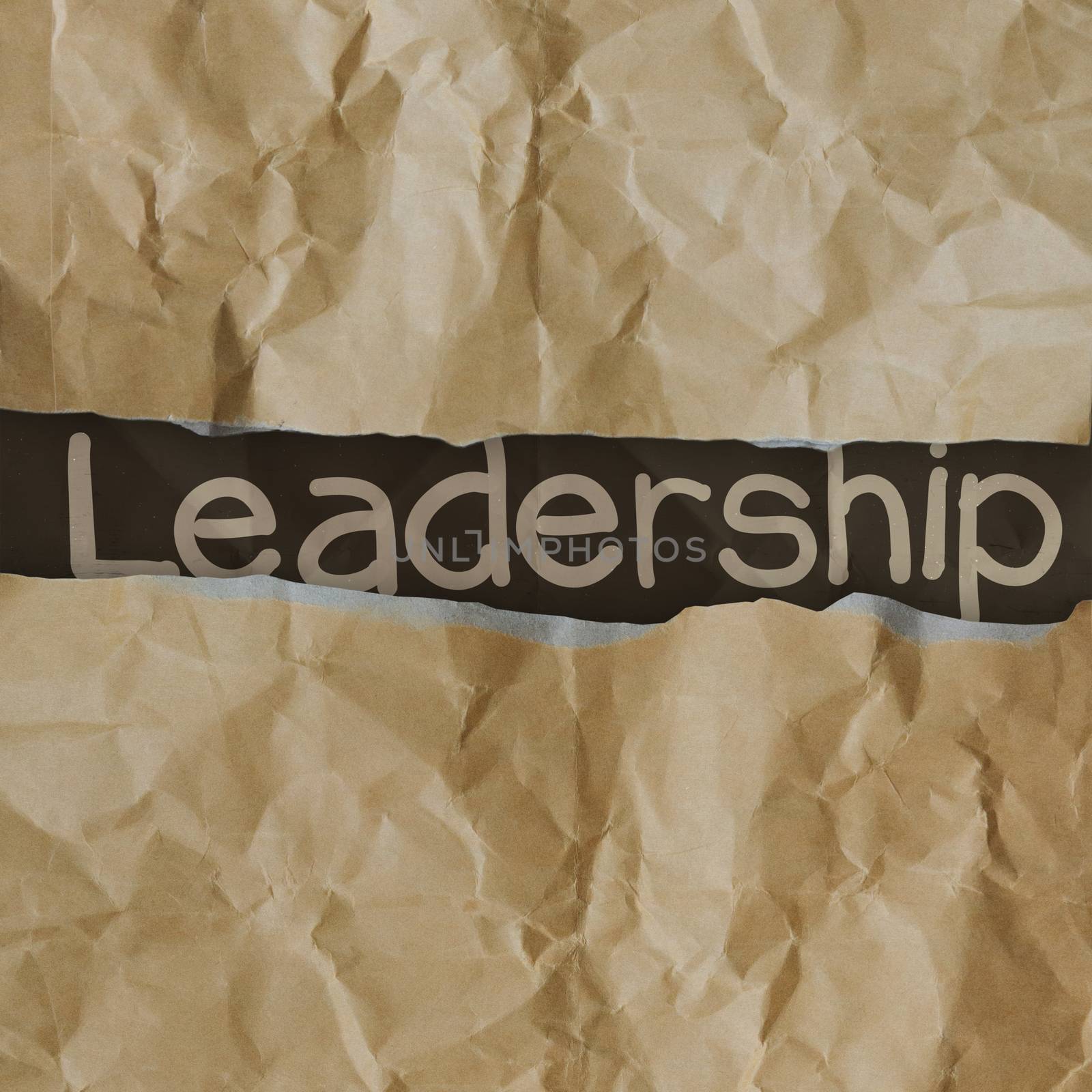 hand drawn  leadership words on crumpled paper with tear envelope as concept