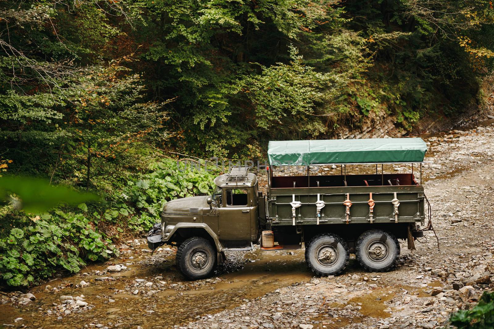 Soviet truck in the Carpathian Mountains carries people on excursions. by Denys_N