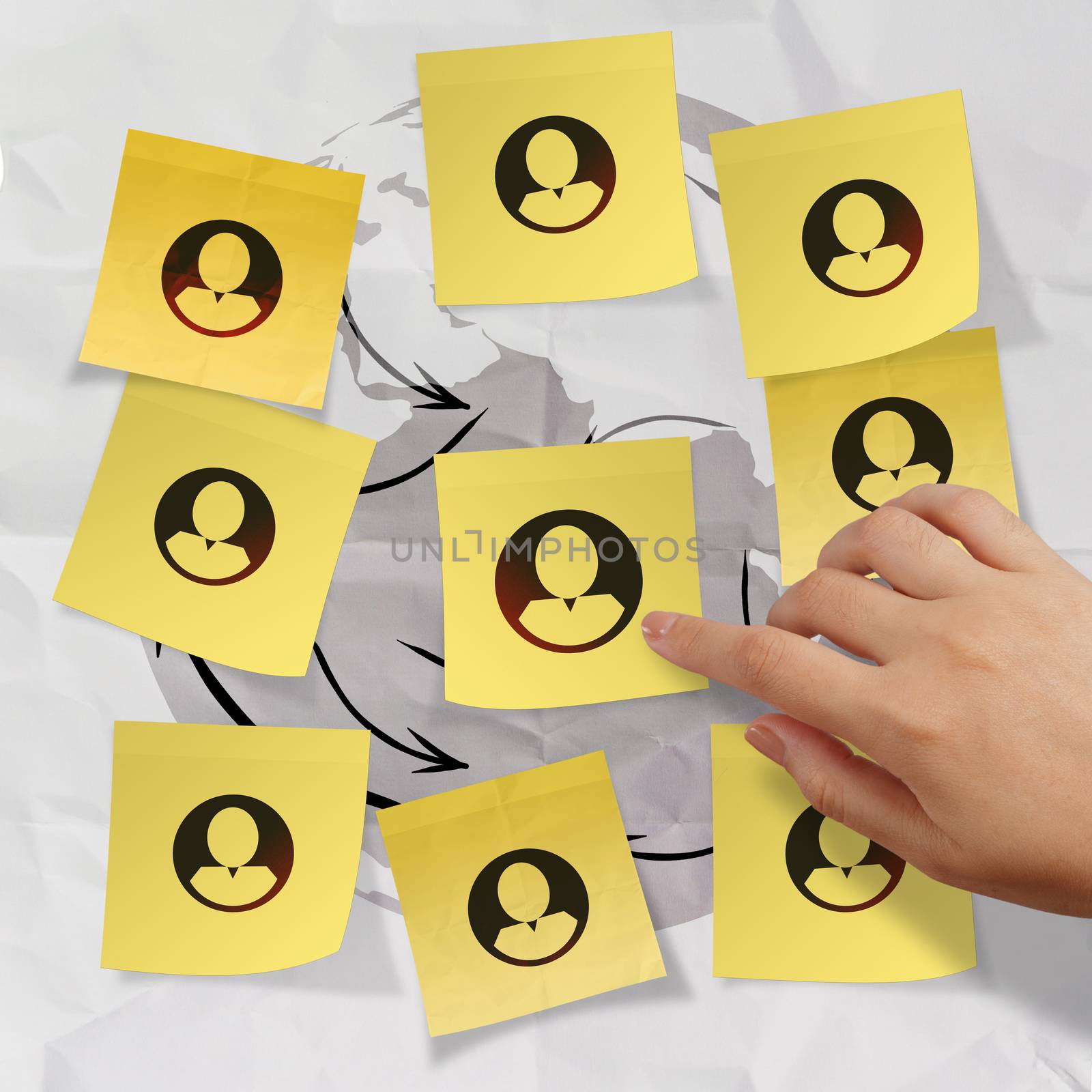 hand pushing sticky note social network icon on crumpled paper b by everythingpossible