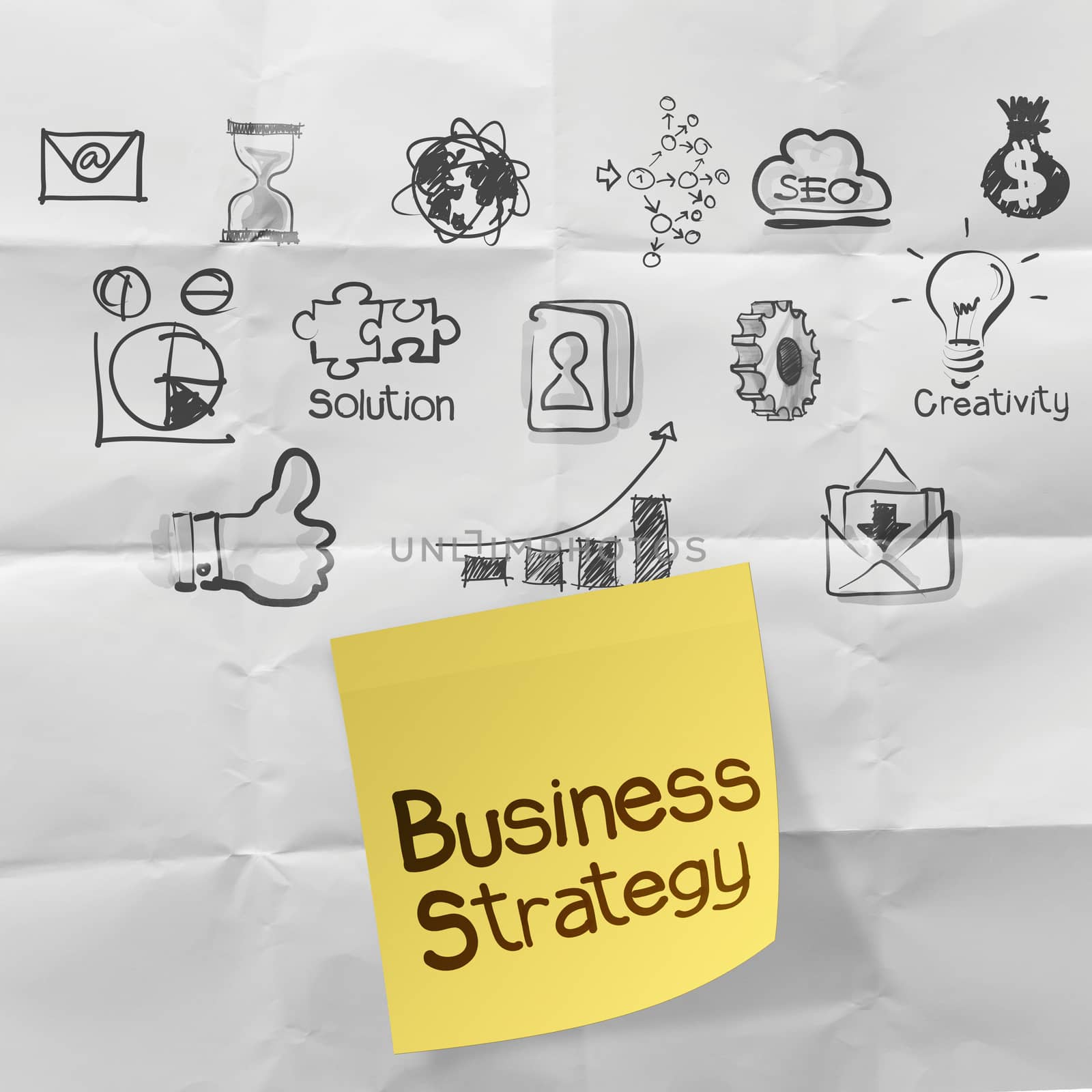 hand drawn creative business strategy on crumpled paper backgrou by everythingpossible