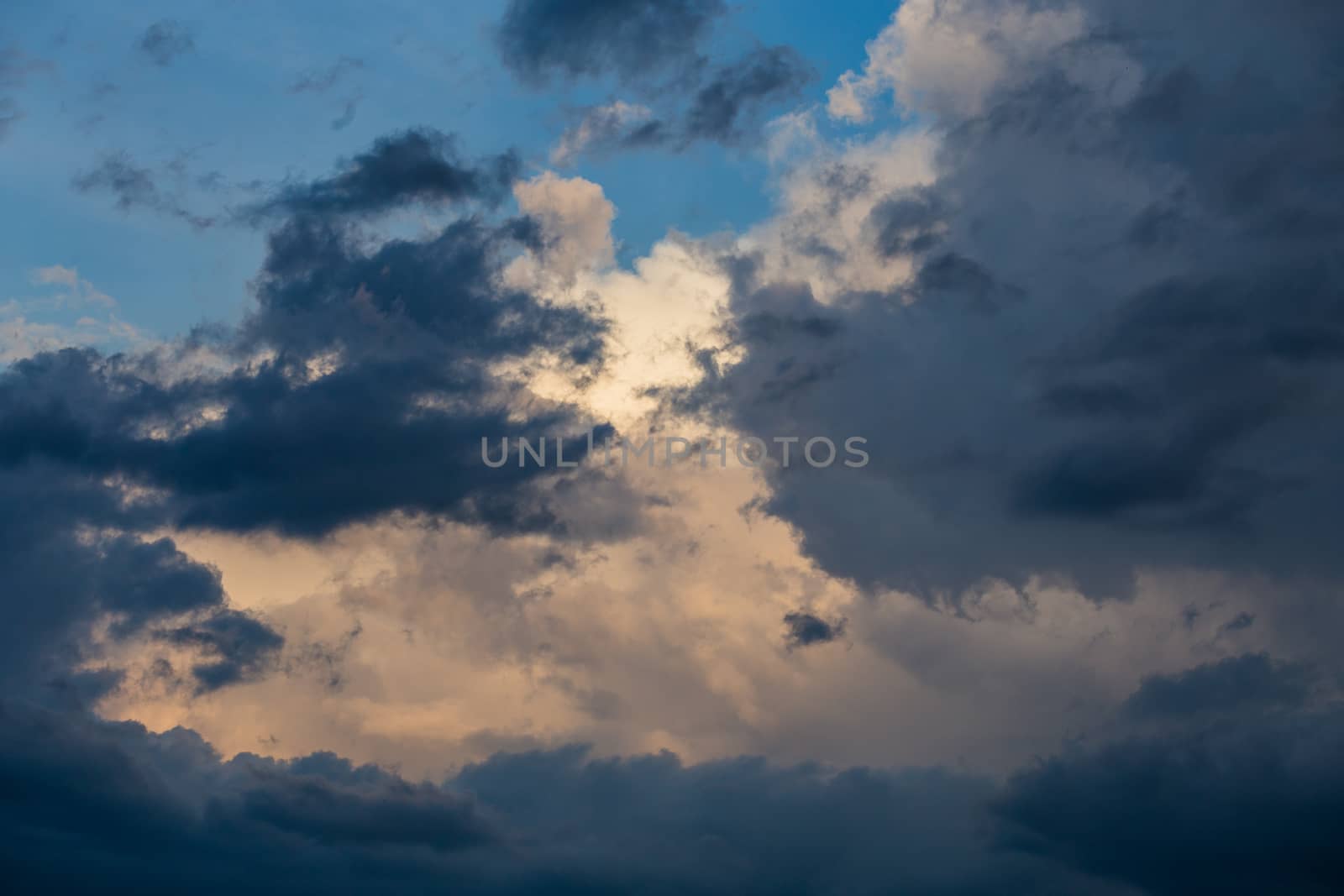 evening summer clouds background in different contrast shades.