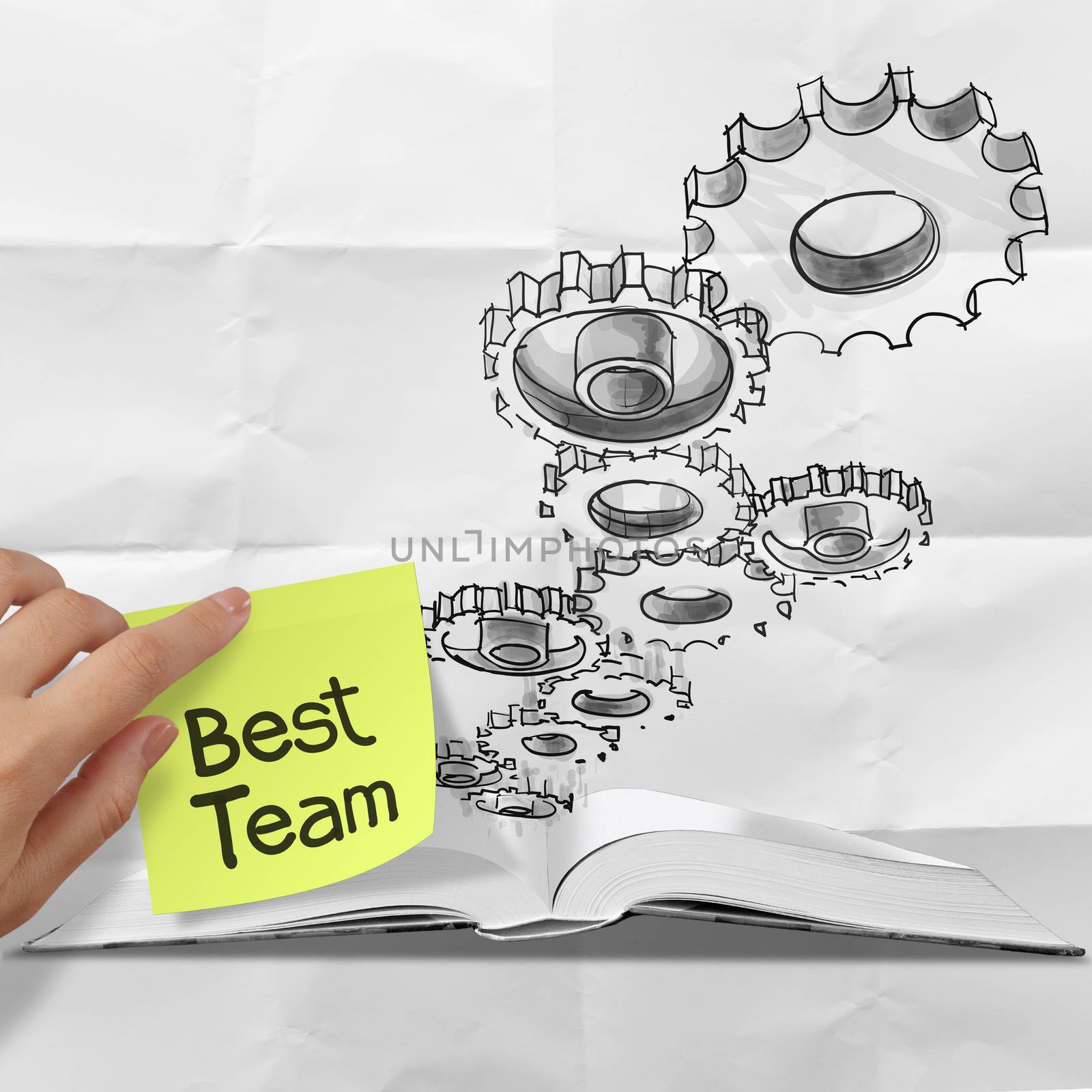 hand drawn gear cog best team with sticky note on crumpled paper by everythingpossible