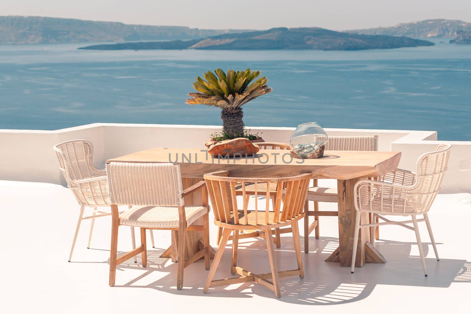 Classical view on the decoration and architecture of Oia village Santorini at sun weather by VIIIPhoto