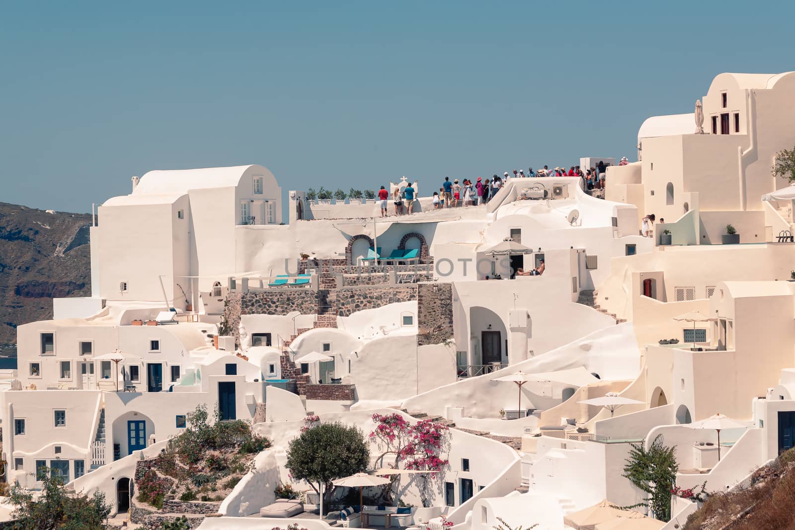 Classical view on the decoration and architecture of Oia village Santorini at sun weather by VIIIPhoto