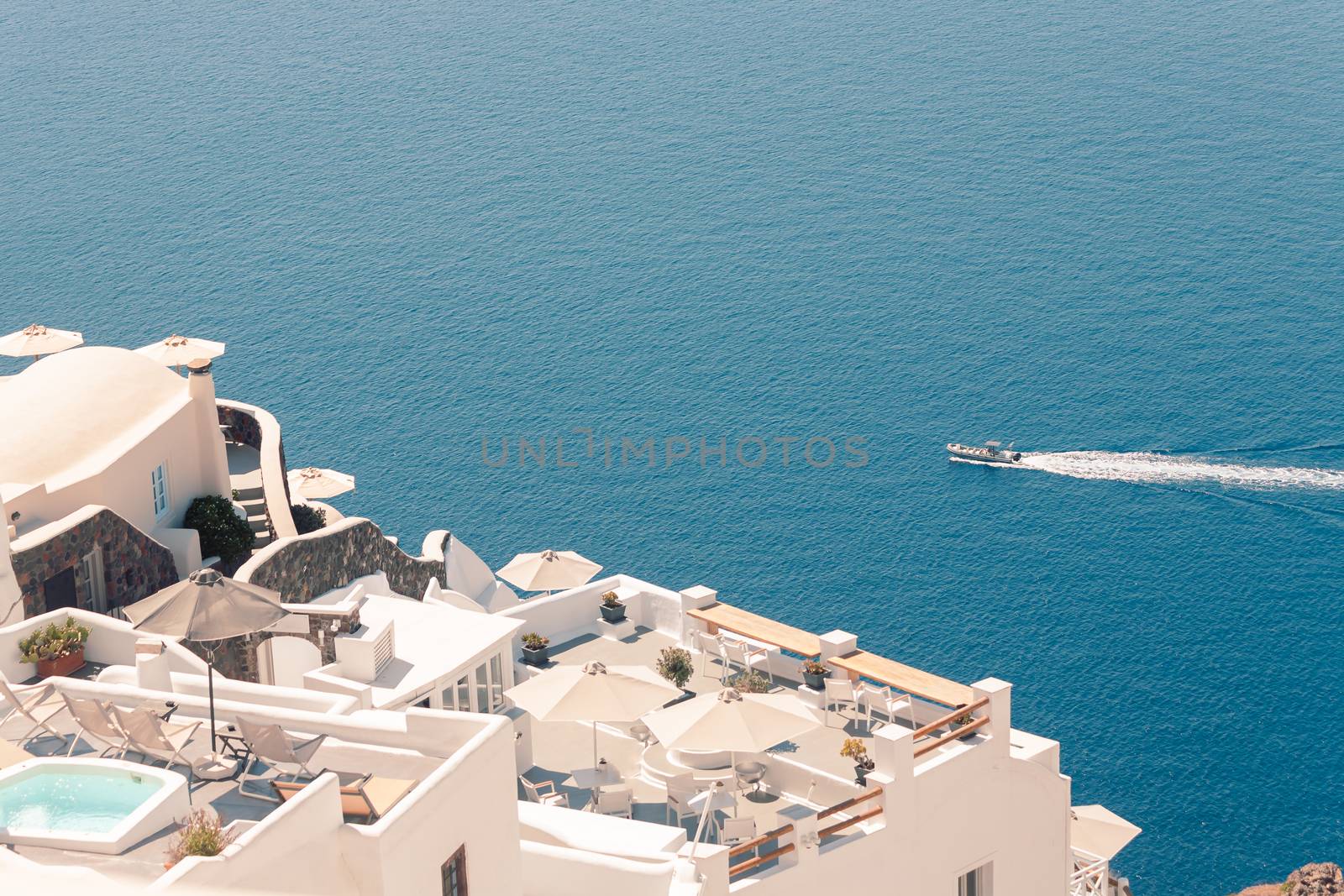 View on the seaside of Santorini island with ship on the sea