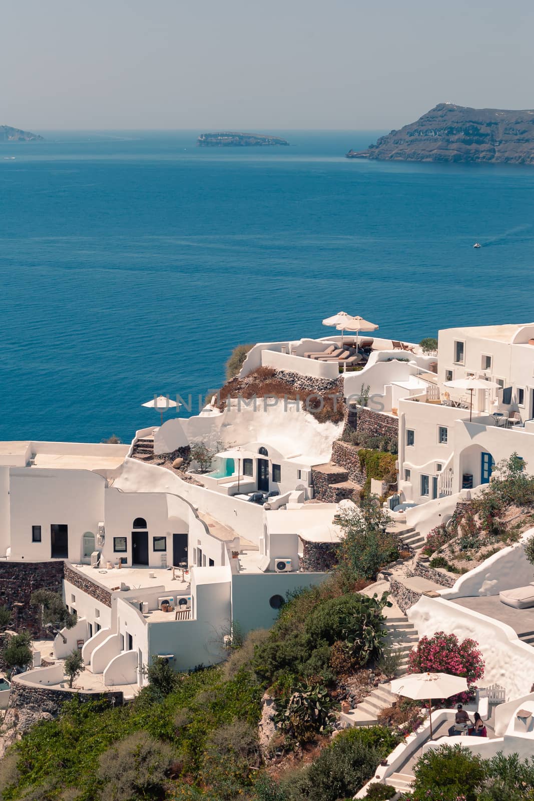 Classical view on the decoration and architecture of Oia village Santorini at sun weather by VIIIPhoto