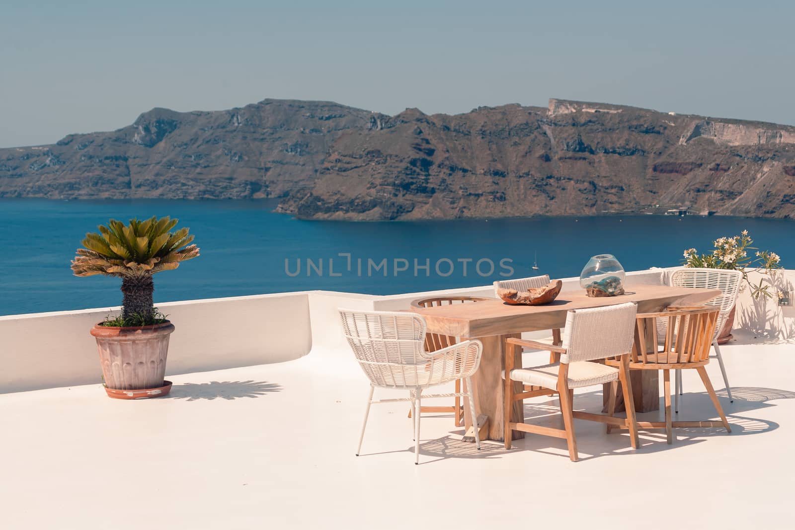 Classical view on the decoration and architecture of Oia village Santorini at sun weather by VIIIPhoto