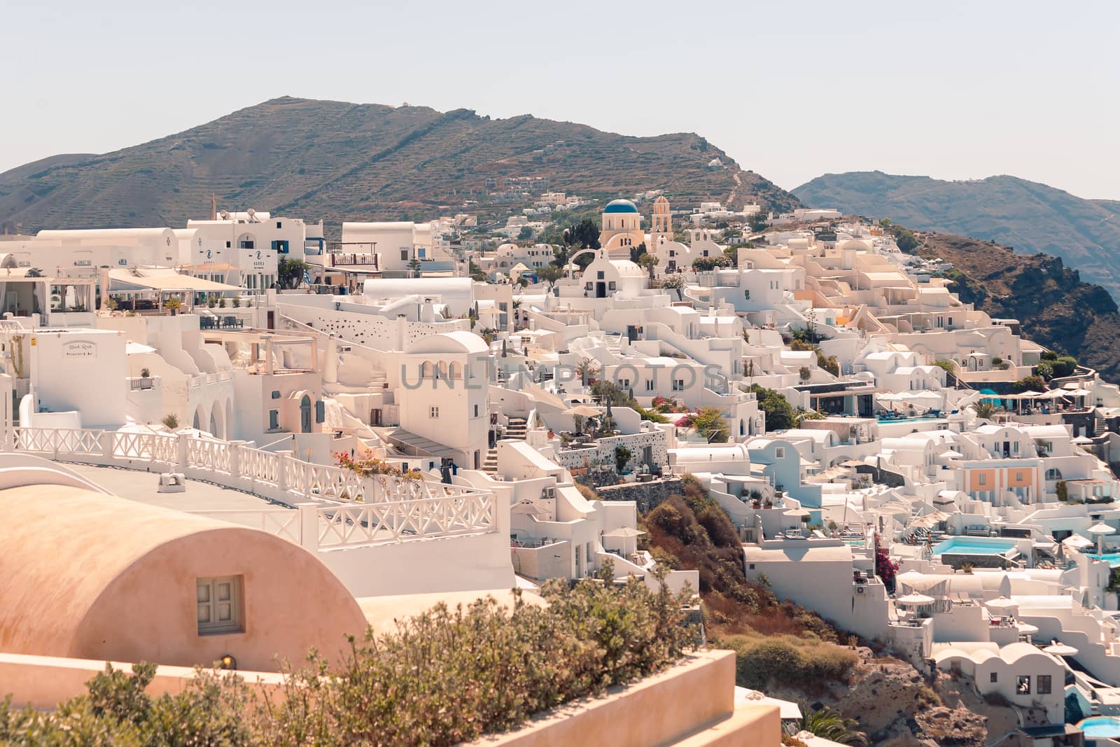 Classical view on the decoration and architecture of Oia village Santorini at sun weather