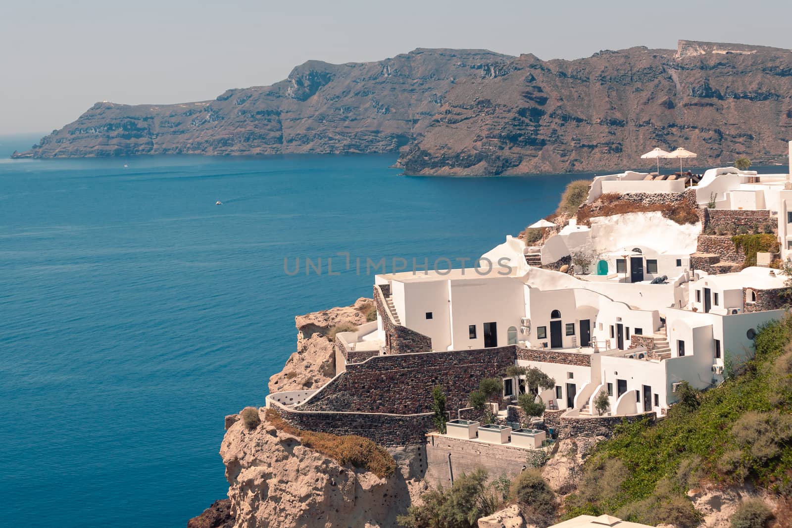 Classical view on the decoration and architecture of Oia village Santorini at sun weather by VIIIPhoto