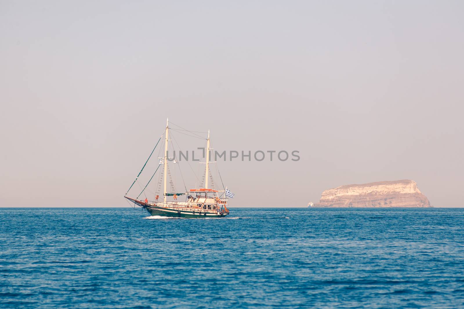 View on the seaside of Santorini island with ship on the sea