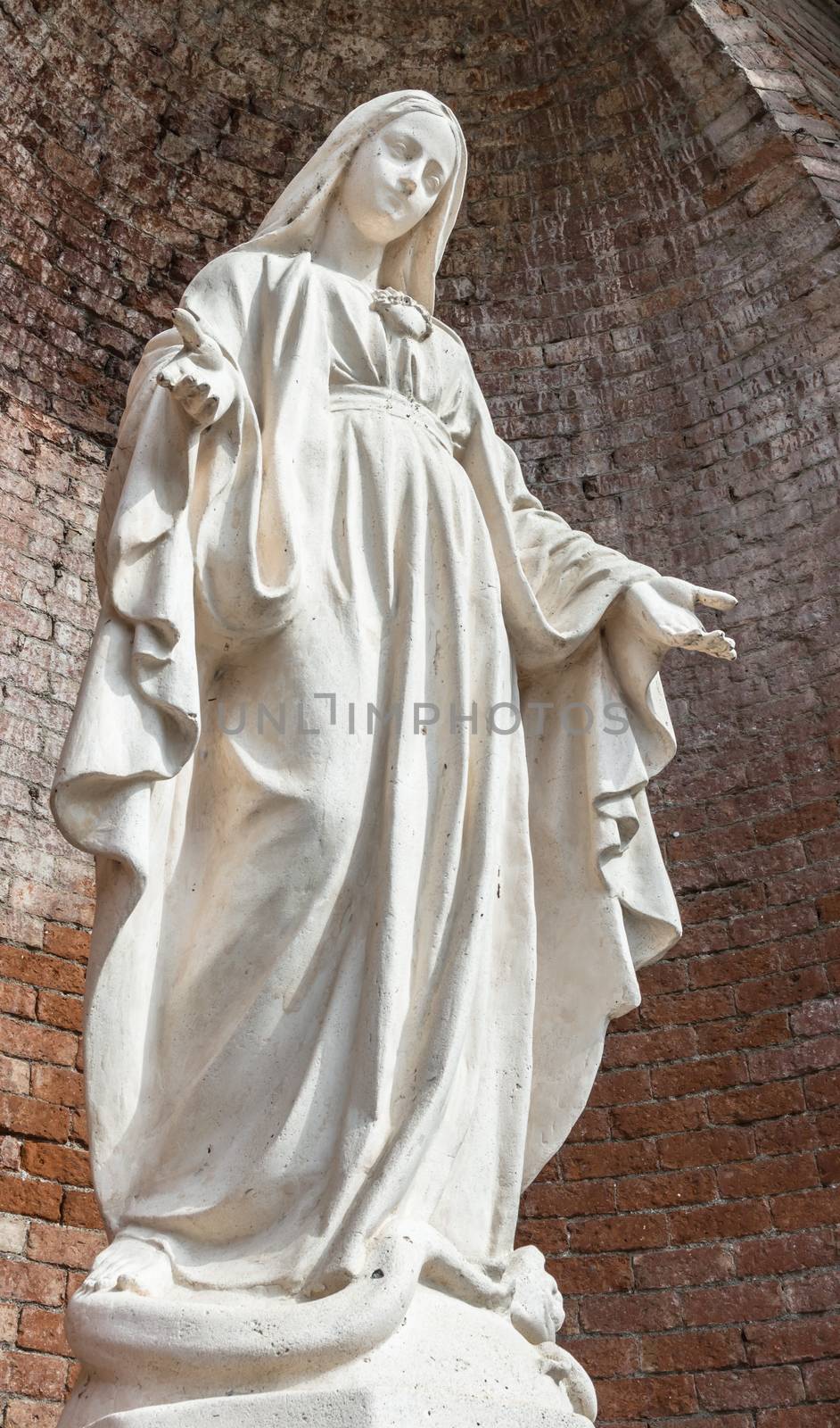 Close-up of Our Lady with open arms, bottom view.