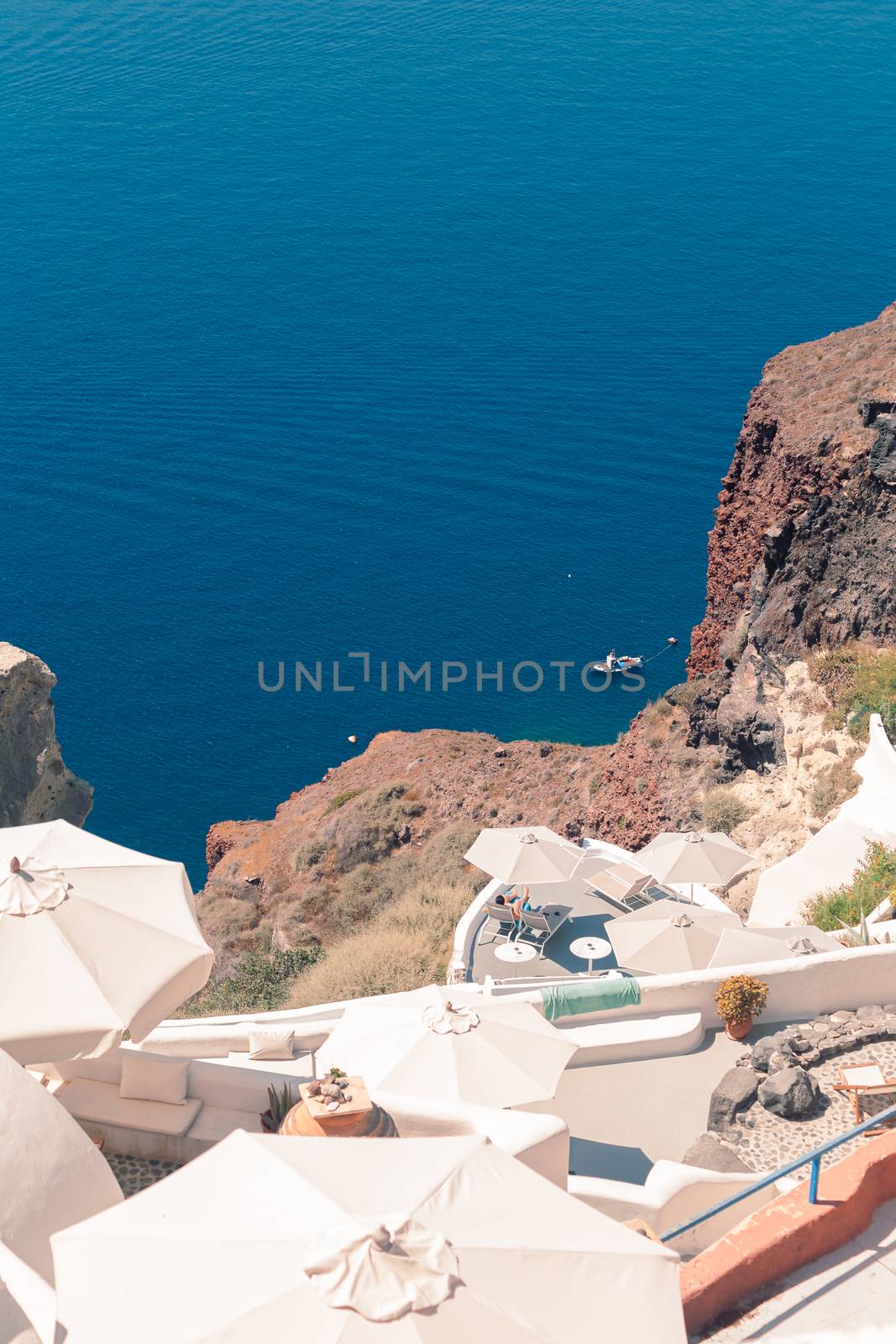 View on the seaside of Santorini island with ship on the sea