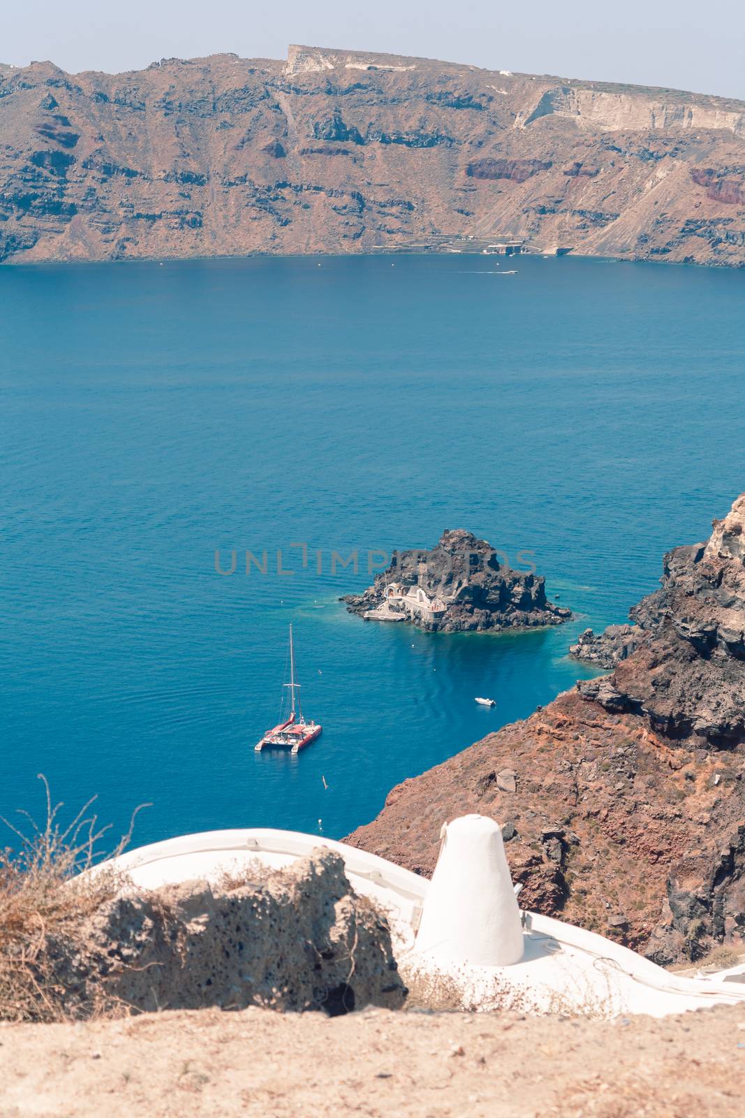 View on the seaside of Santorini island with ship on the sea