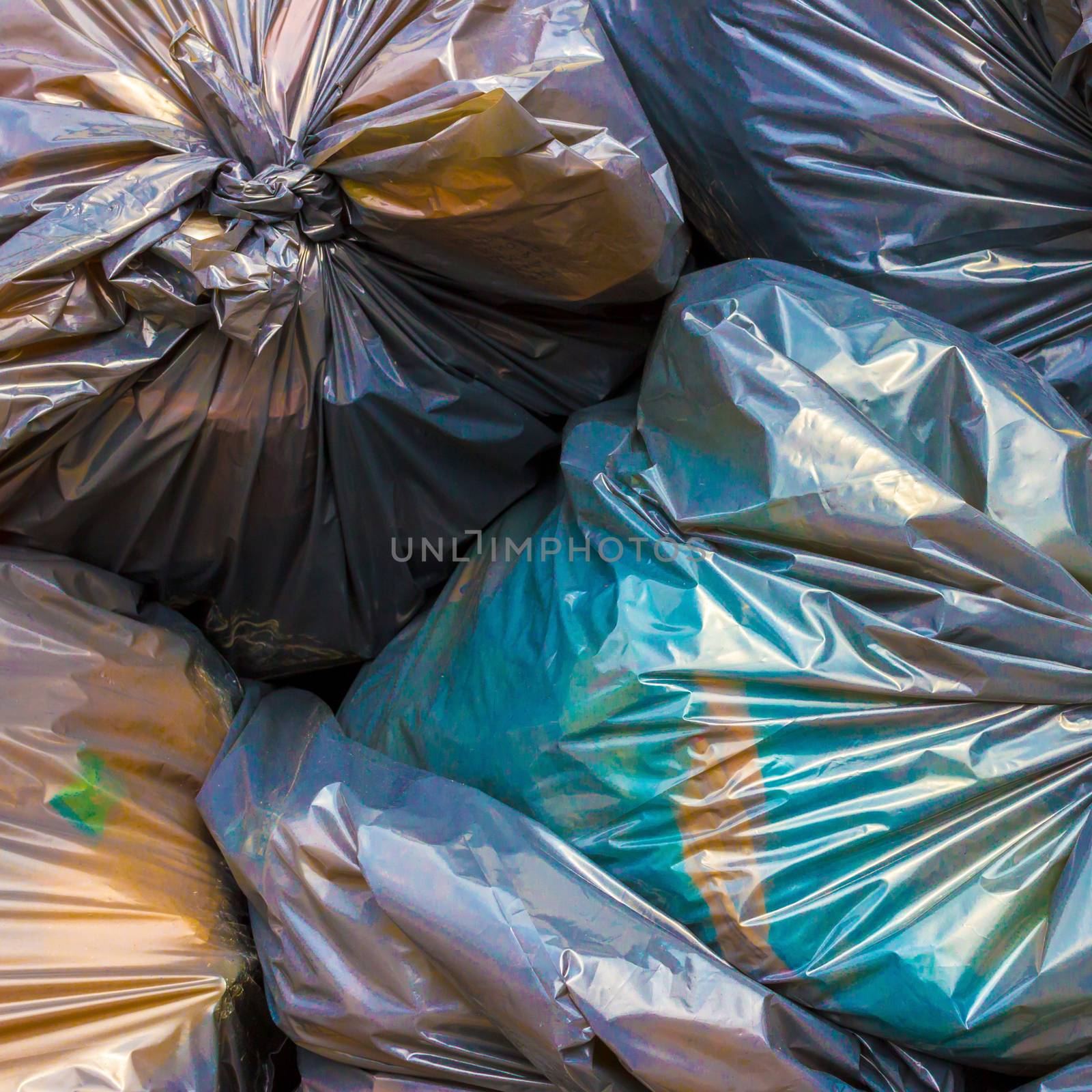 Pile of garbage and waiste in colorfull bags