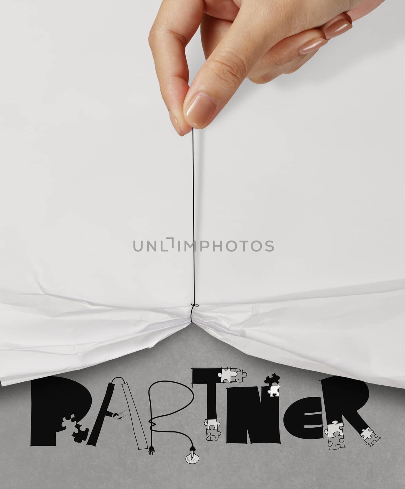 business hand pull rope open wrinkled paper show PARTNER design text as concept