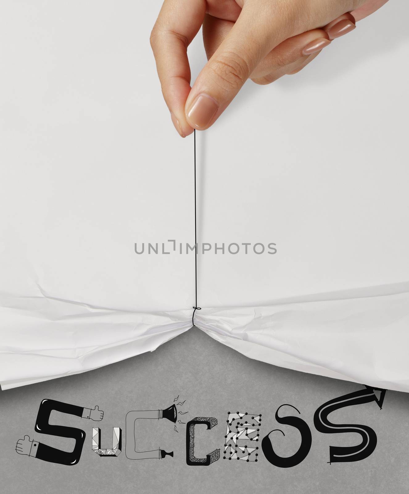 business hand pull rope open wrinkled paper show SUCCESS design text as concept