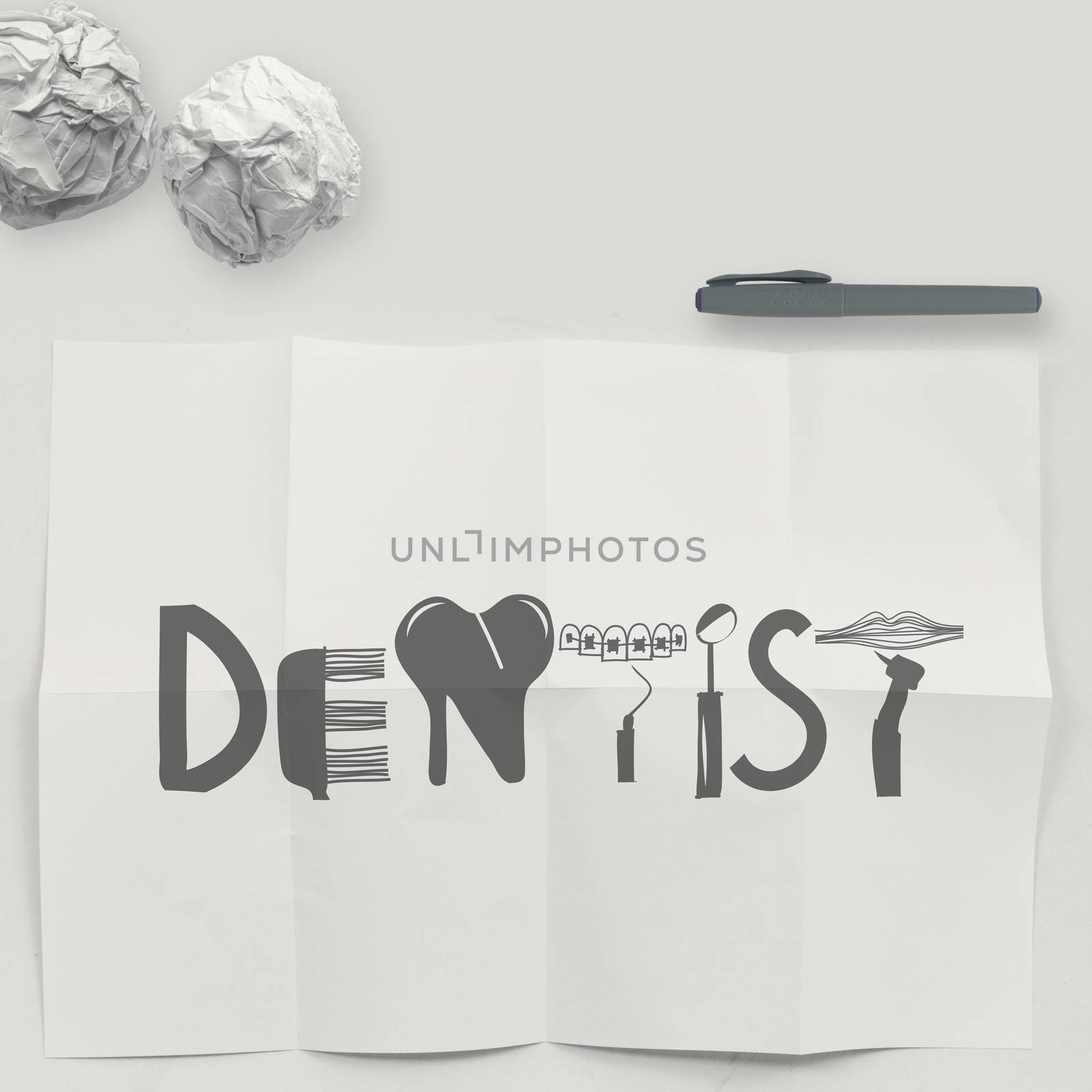 design word DENTIST on white crumpled paper and texture background as concept
