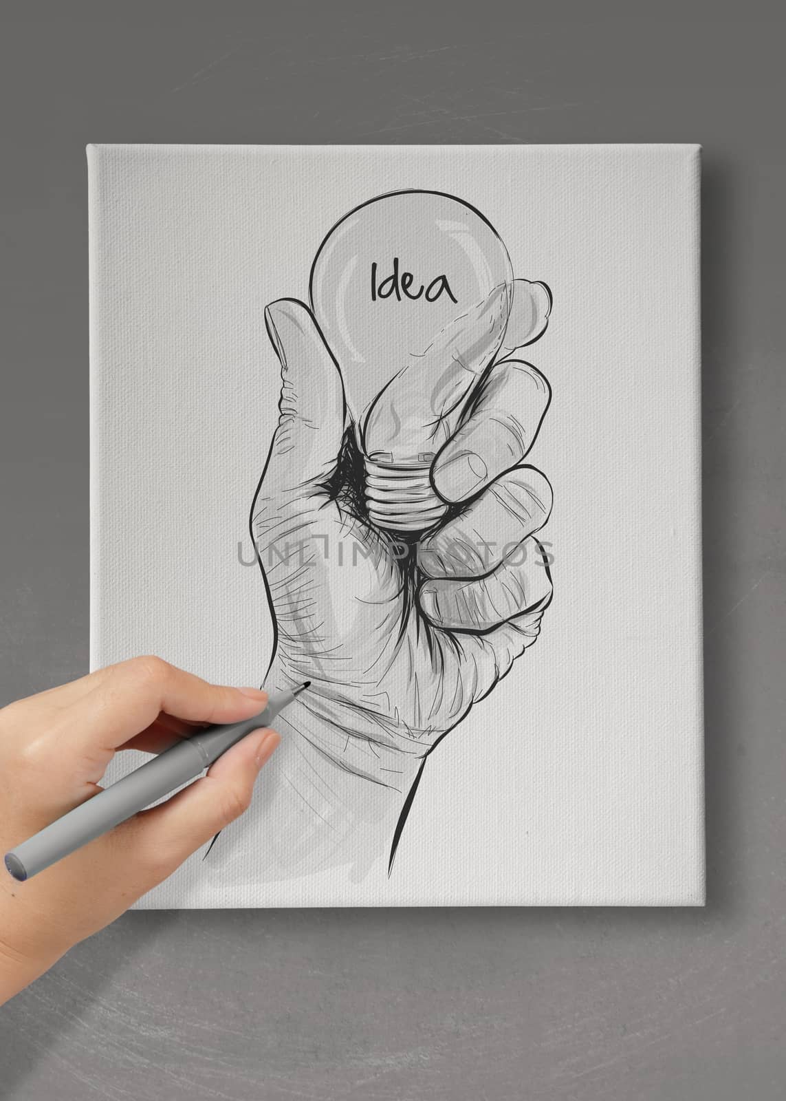 Hand drawn light bulb with IDEA word on canvas board as concept