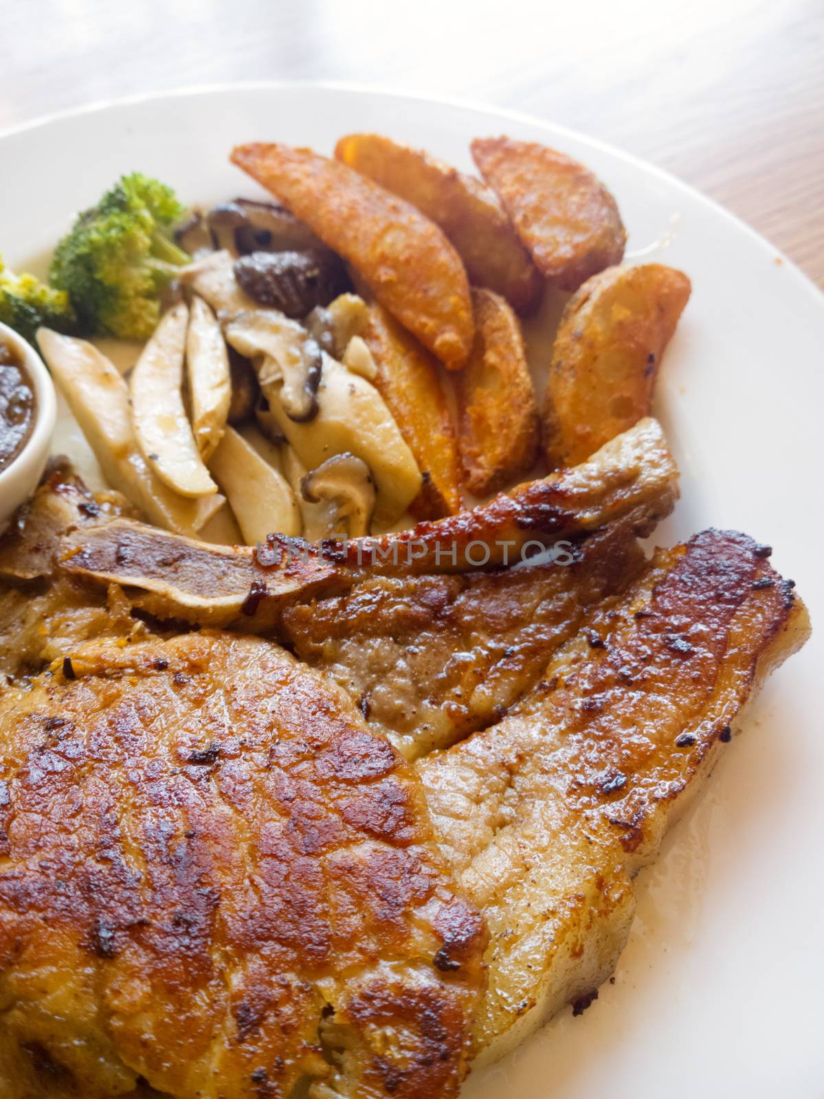 Pork steak with vegetables and french fried