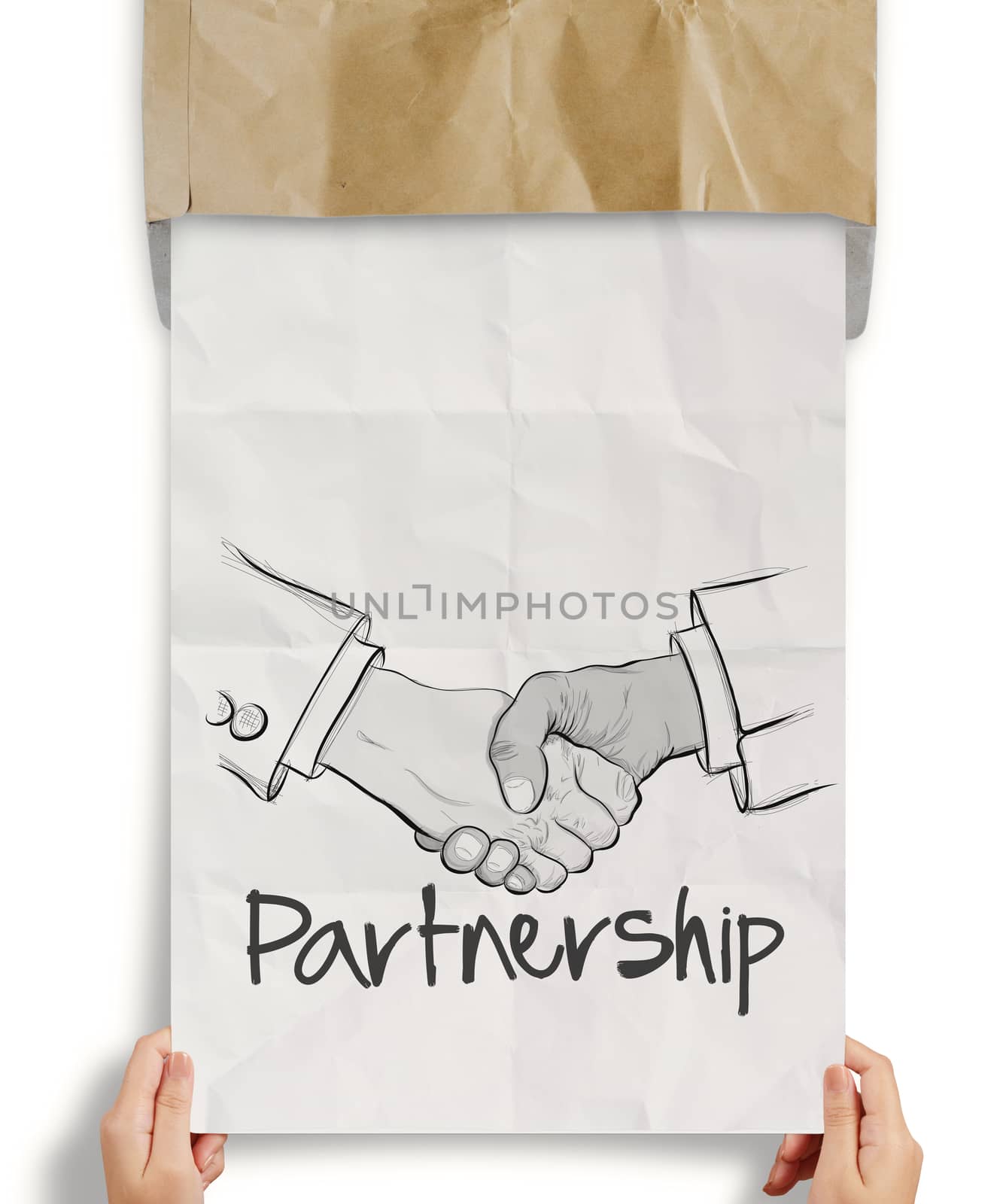 hand drawn handshake sign on crumpled paper as partnership business concept