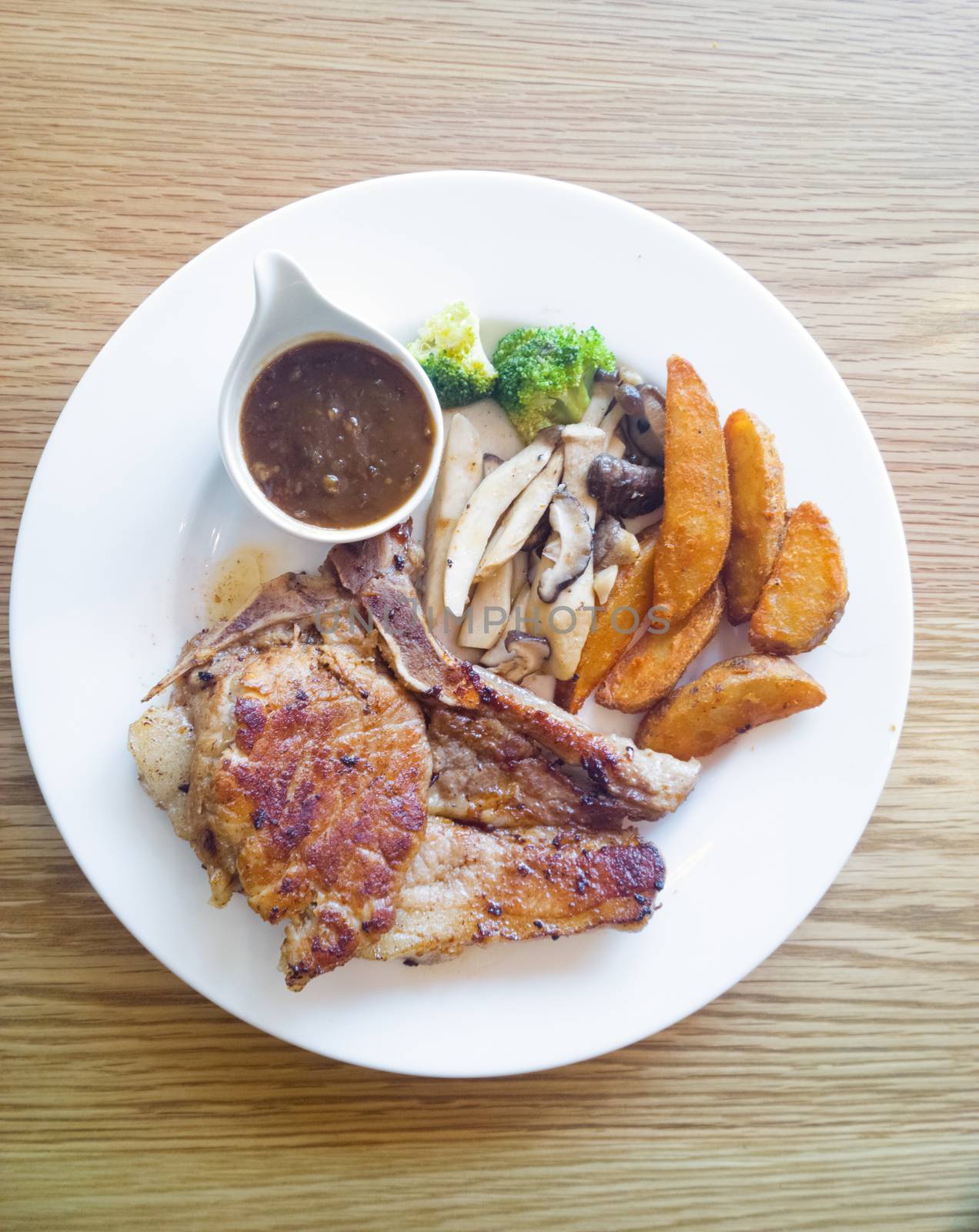 Pork steak with vegetables and french fried by everythingpossible
