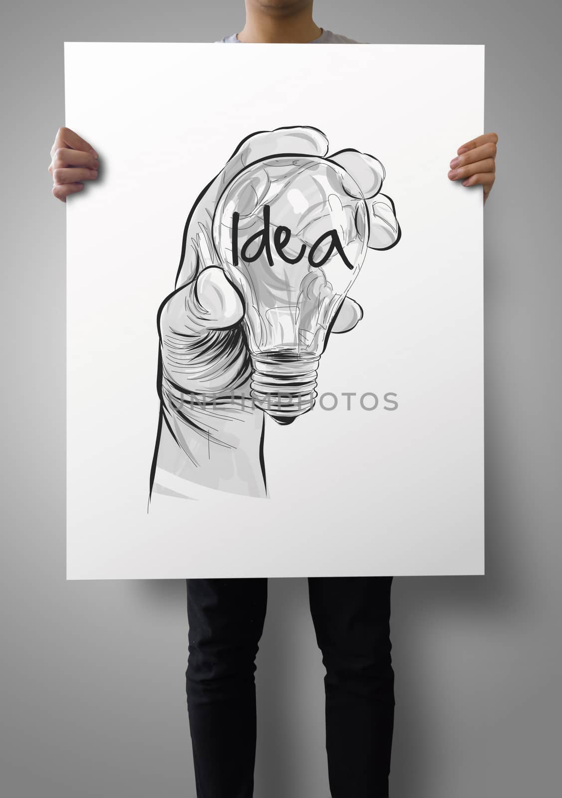man showing poster of Hand drawn light bulb with IDEA word on crumpled paper as concept
