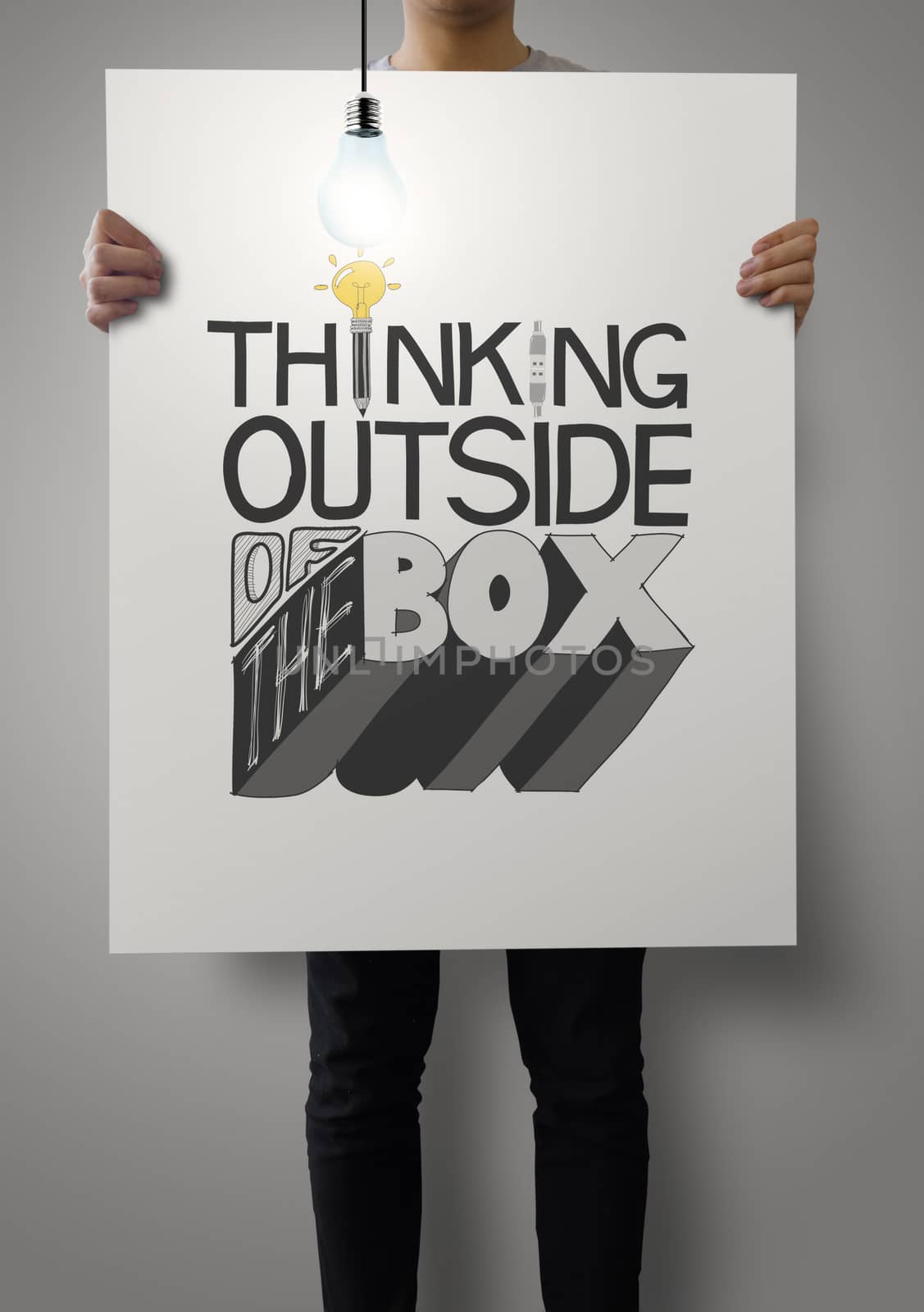 man showing poster of hand drawn  word THINKING OUTSIDE OF THE B by everythingpossible