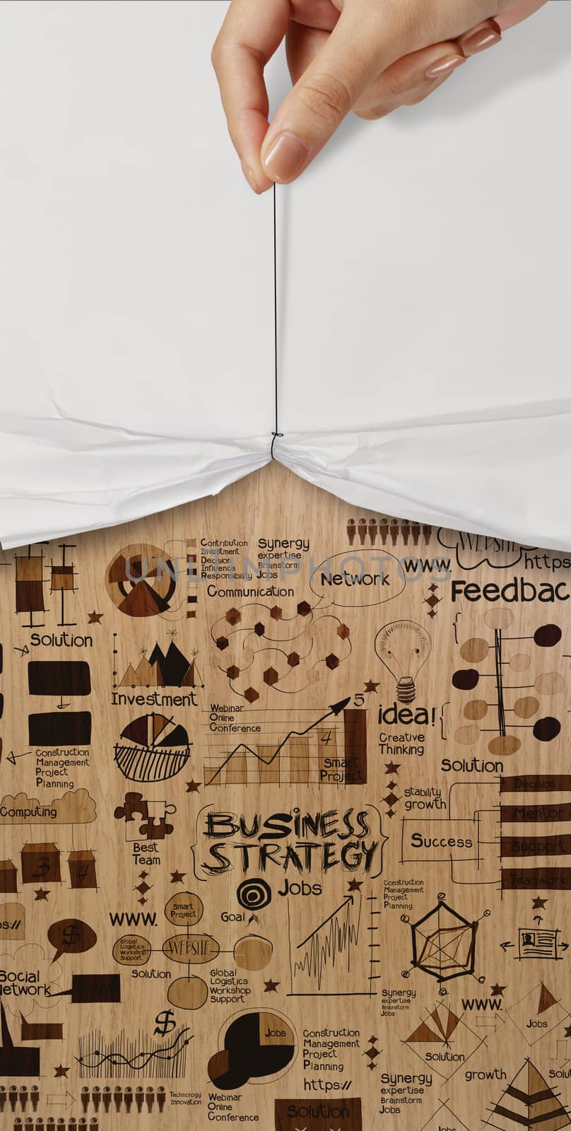open crumpled paper showing hand drawn strategy business diagram on wood background as concept 