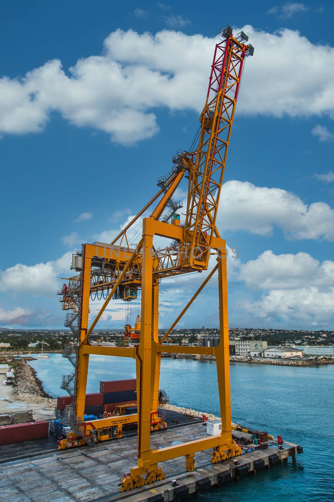 Massive yellow freight crane in harbor of Bridgetown Barbados
