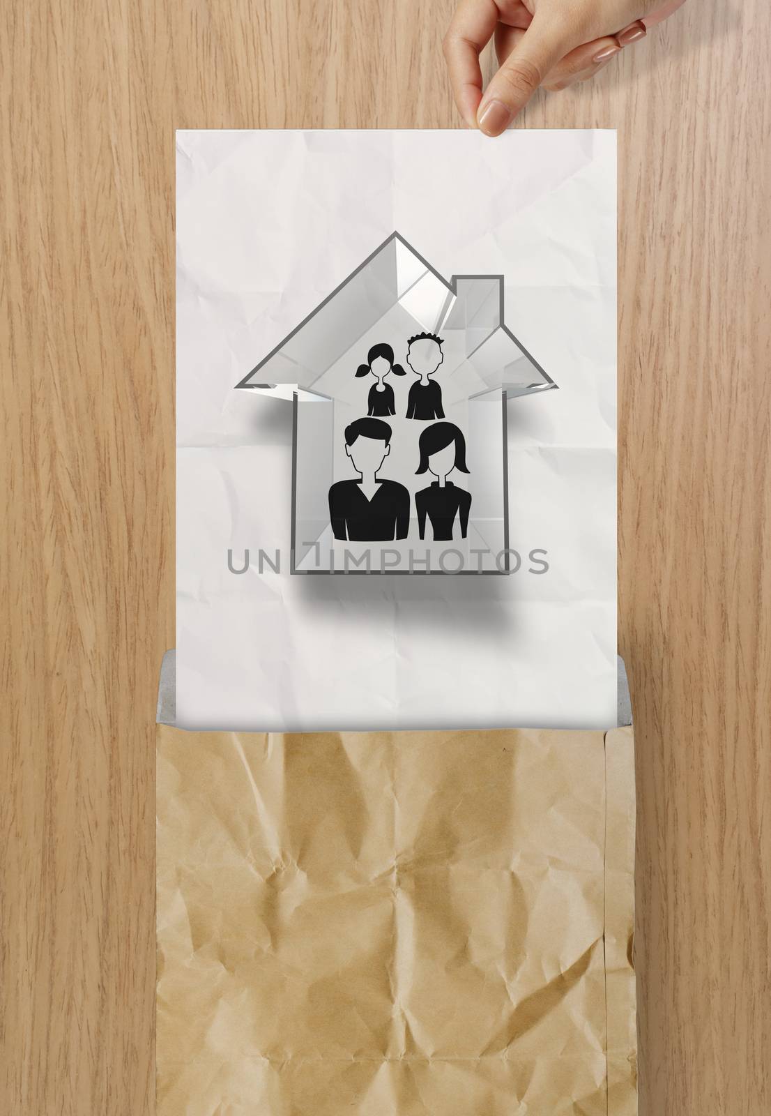 hand open crumpled paper to show hand draw family and house icon by everythingpossible