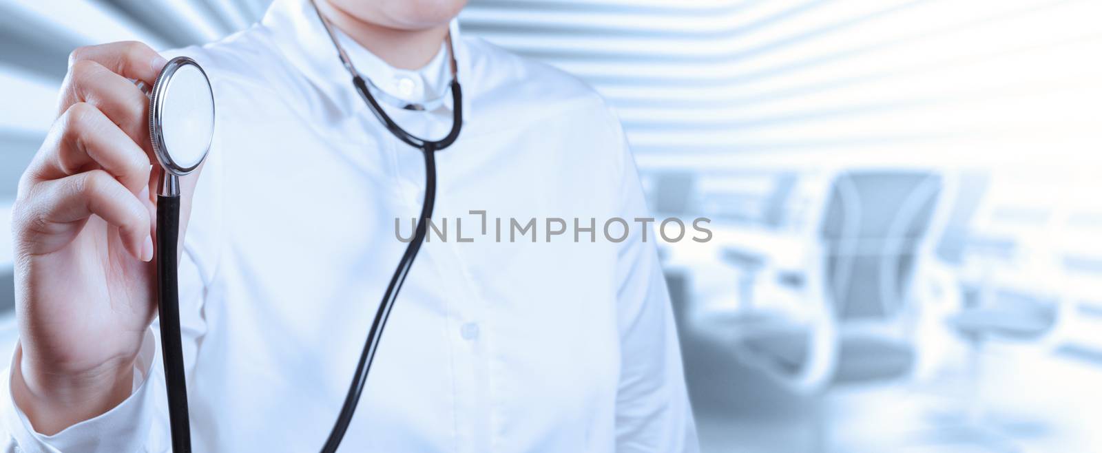 Doctor with a stethoscope in the hands and office background  by everythingpossible