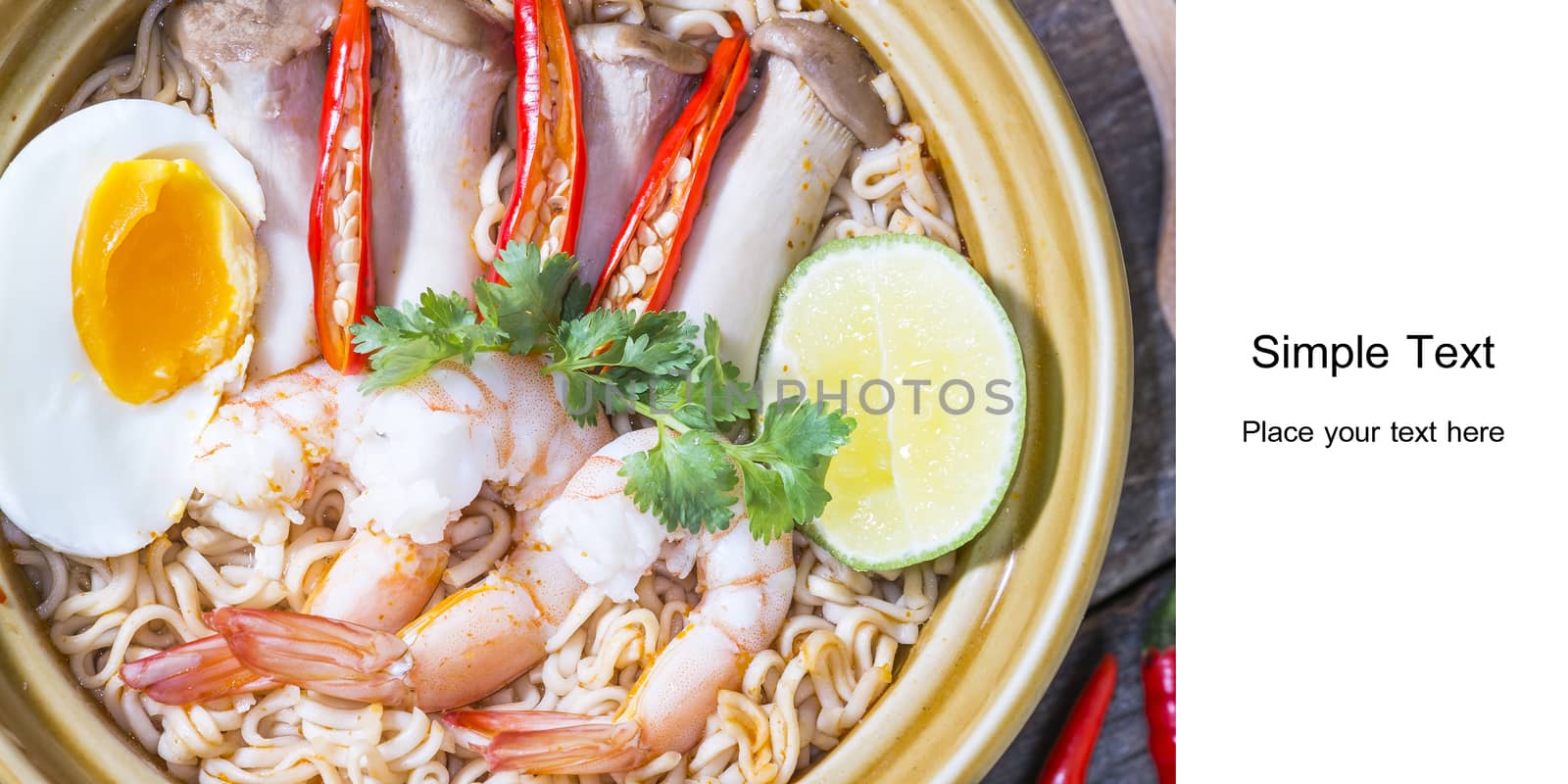 Thai food style noodle, tom yum kung on wood background and space for text

