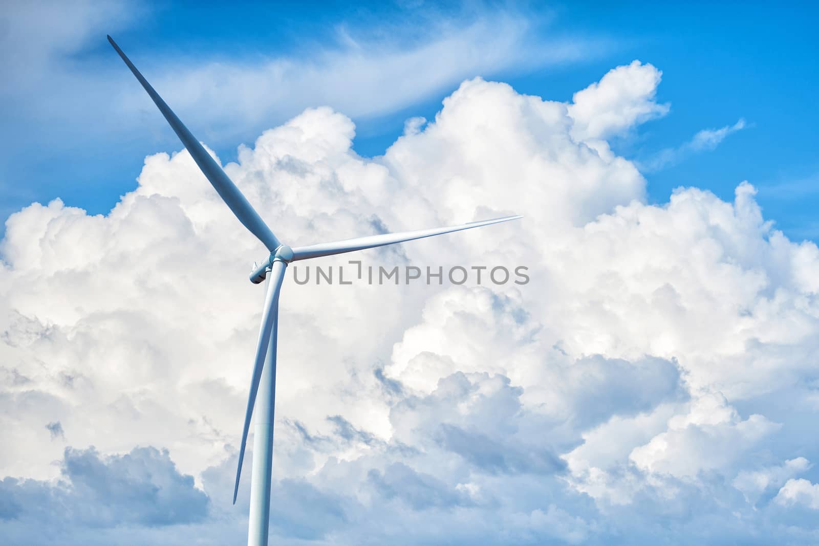 Wind turbine power on the big cloud background by Surasak