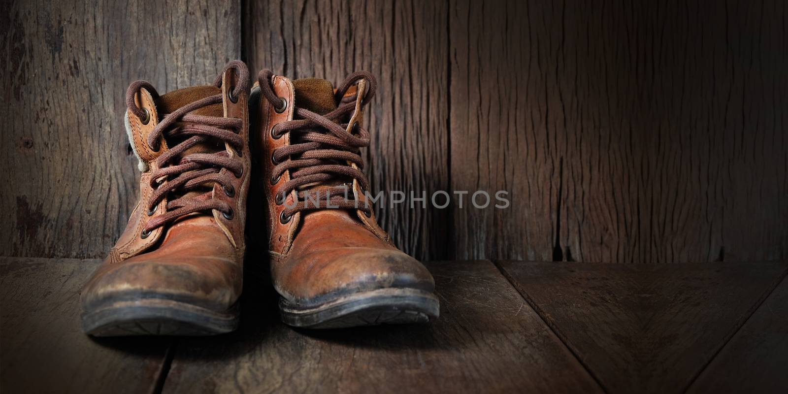 Shoe hat and accessories travel set on a wooden background and s by Surasak