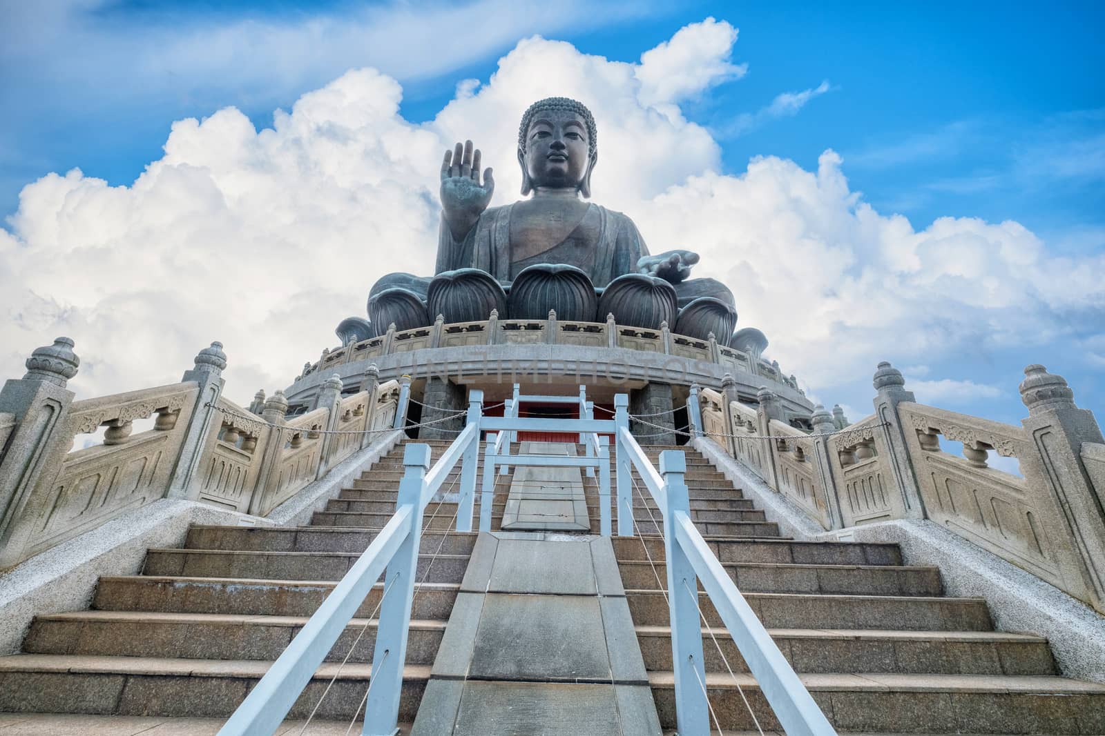 Tian Tan Giant Buddha on big blue sky background by Surasak